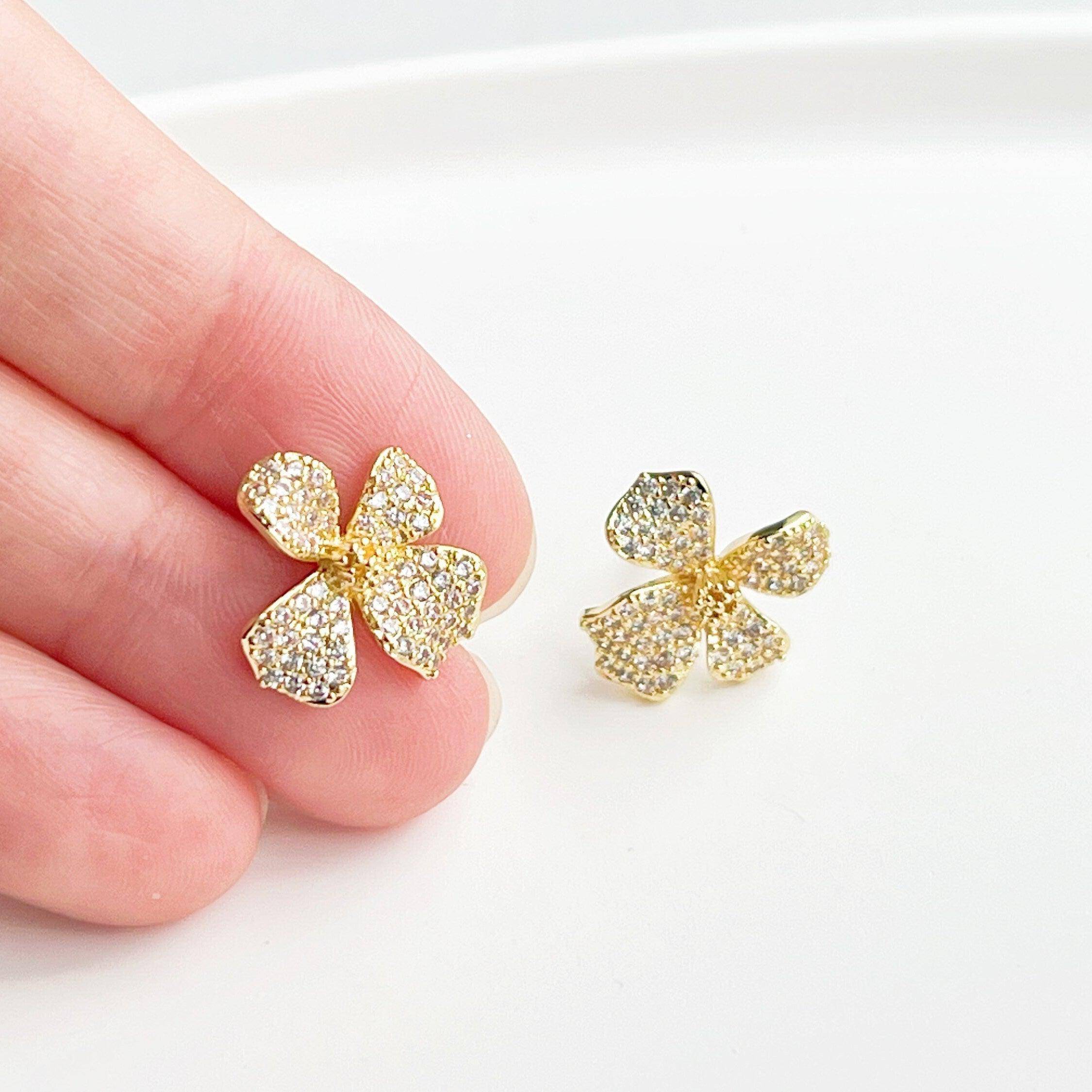 Golden Four Petals Shamrock Earrings featuring gold-plated bronze, sterling silver studs, and sparkling artificial crystals.