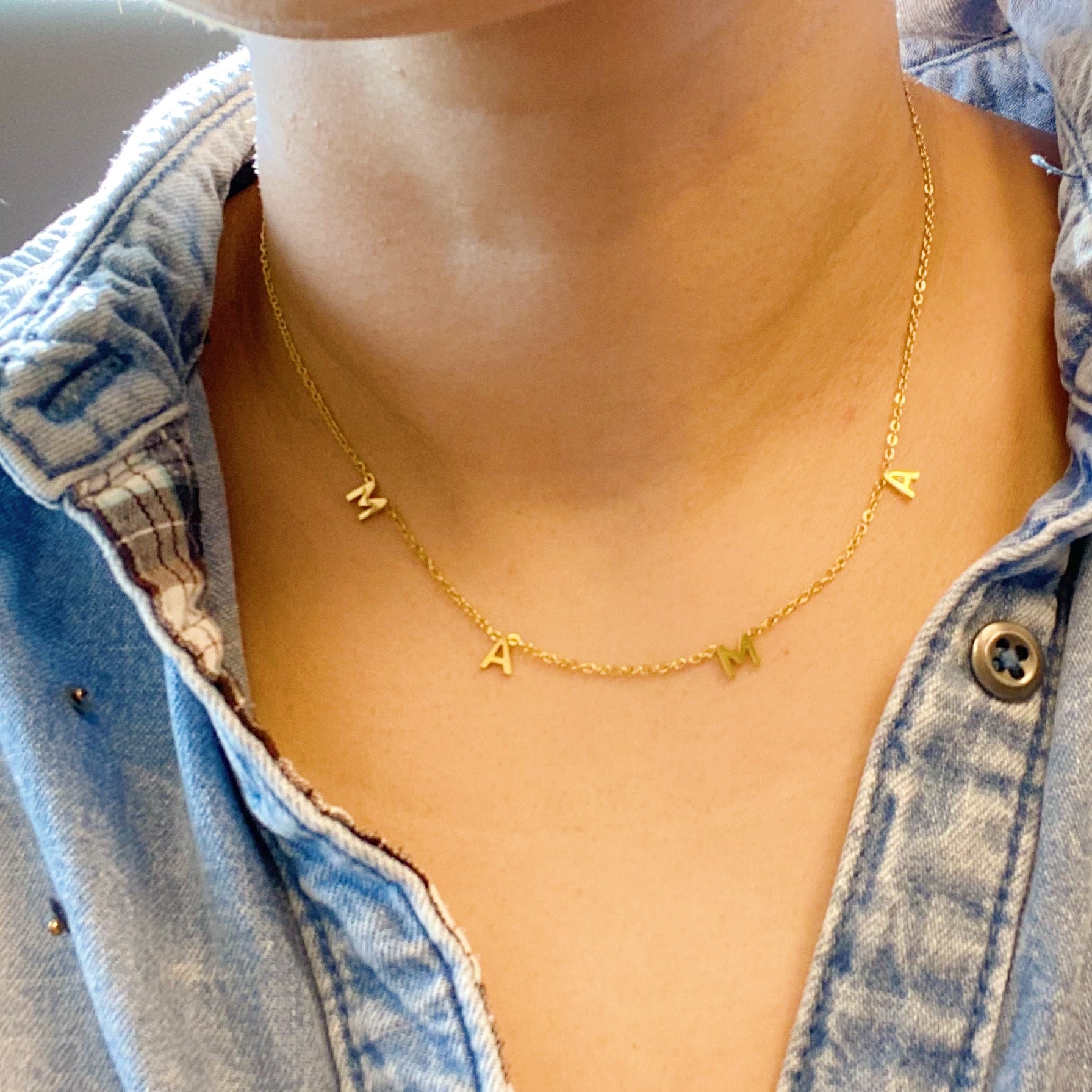 Elegant Golden Mama Necklace with a chic pendant on a 16-inch chain, showcasing its gold plated stainless steel design.