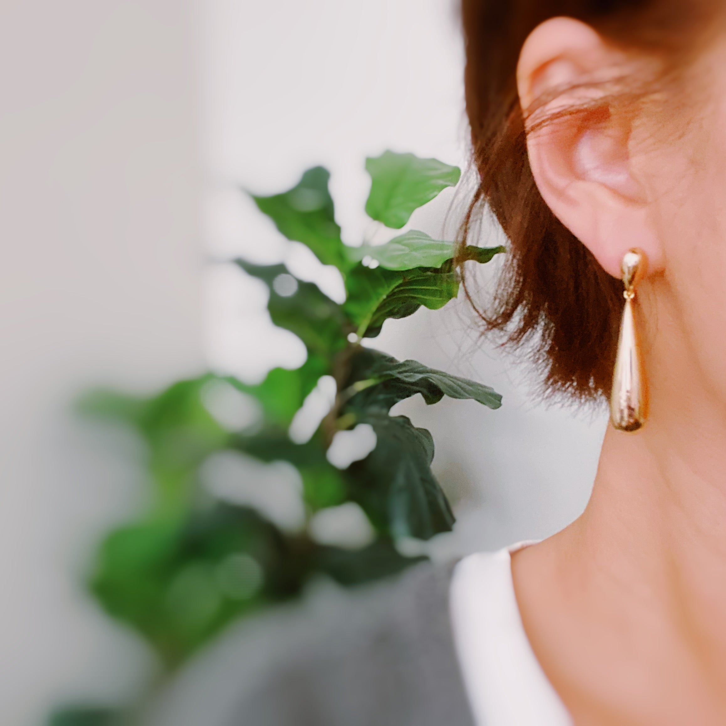 Elegant Golden Object Double Tier Earrings with a sophisticated design, featuring a 2-inch drop length and made from 18k gold plated brass.