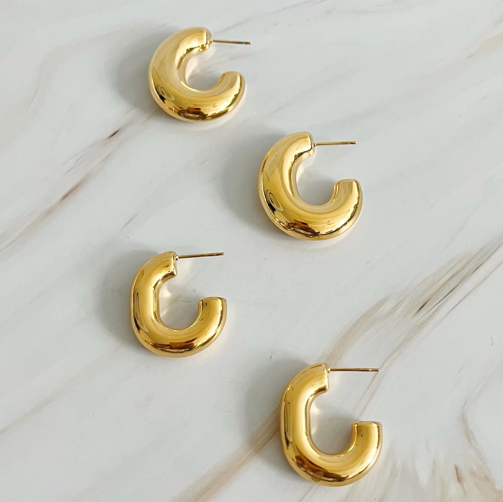 Elegant Golden Object Oval Hoop Earrings in a modern design, crafted from 18k gold plated stainless steel.