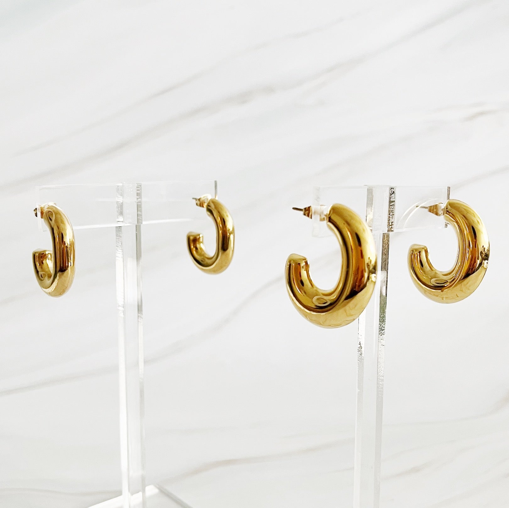 Elegant Golden Object Oval Hoop Earrings in a modern design, crafted from 18k gold plated stainless steel.