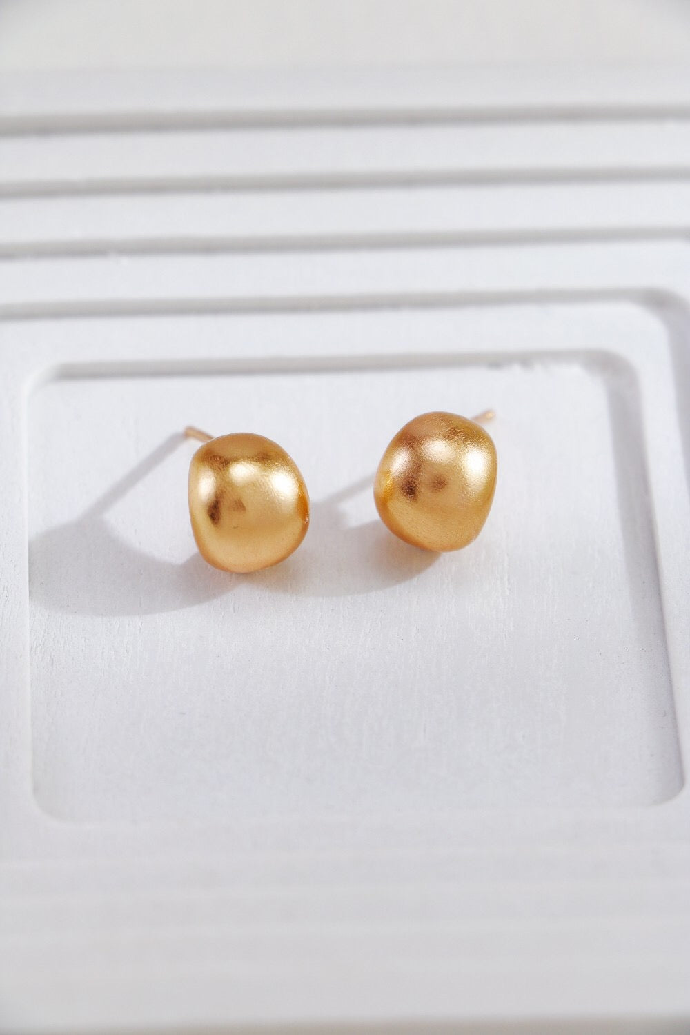 Gold-plated brushed spherical stud earrings, handmade with 18ct gold plating on sterling silver, showcasing a unique brushed texture.