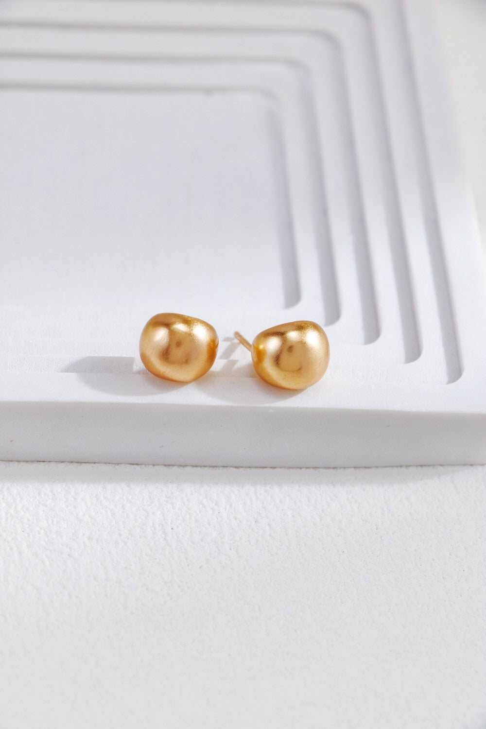 Gold-plated brushed spherical stud earrings, handmade with 18ct gold plating on sterling silver, showcasing a unique brushed texture.