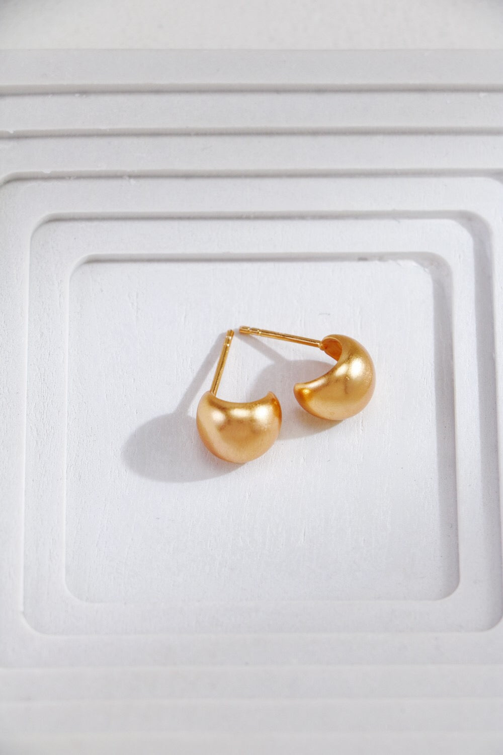 Gold-plated brushed spherical stud earrings, handmade with 18ct gold plating on sterling silver, showcasing a unique brushed texture.