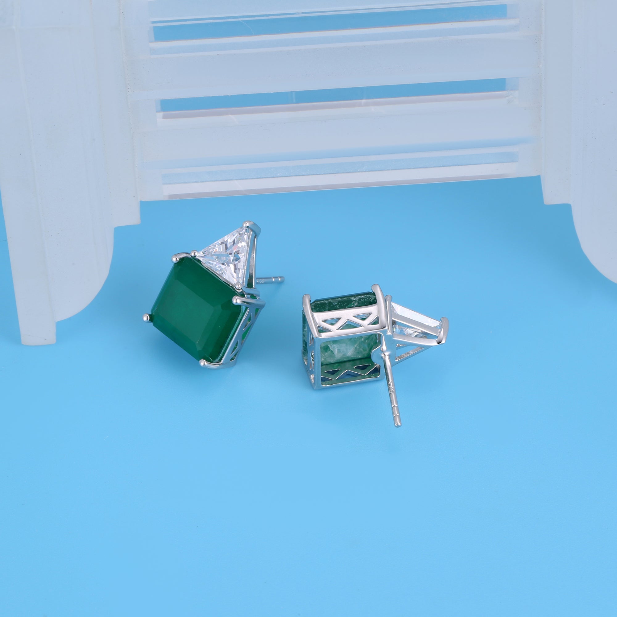 Gorgeous green emerald cutting earrings in .925 sterling silver, showcasing a rich forest green simulated emerald with brilliant sparkle.