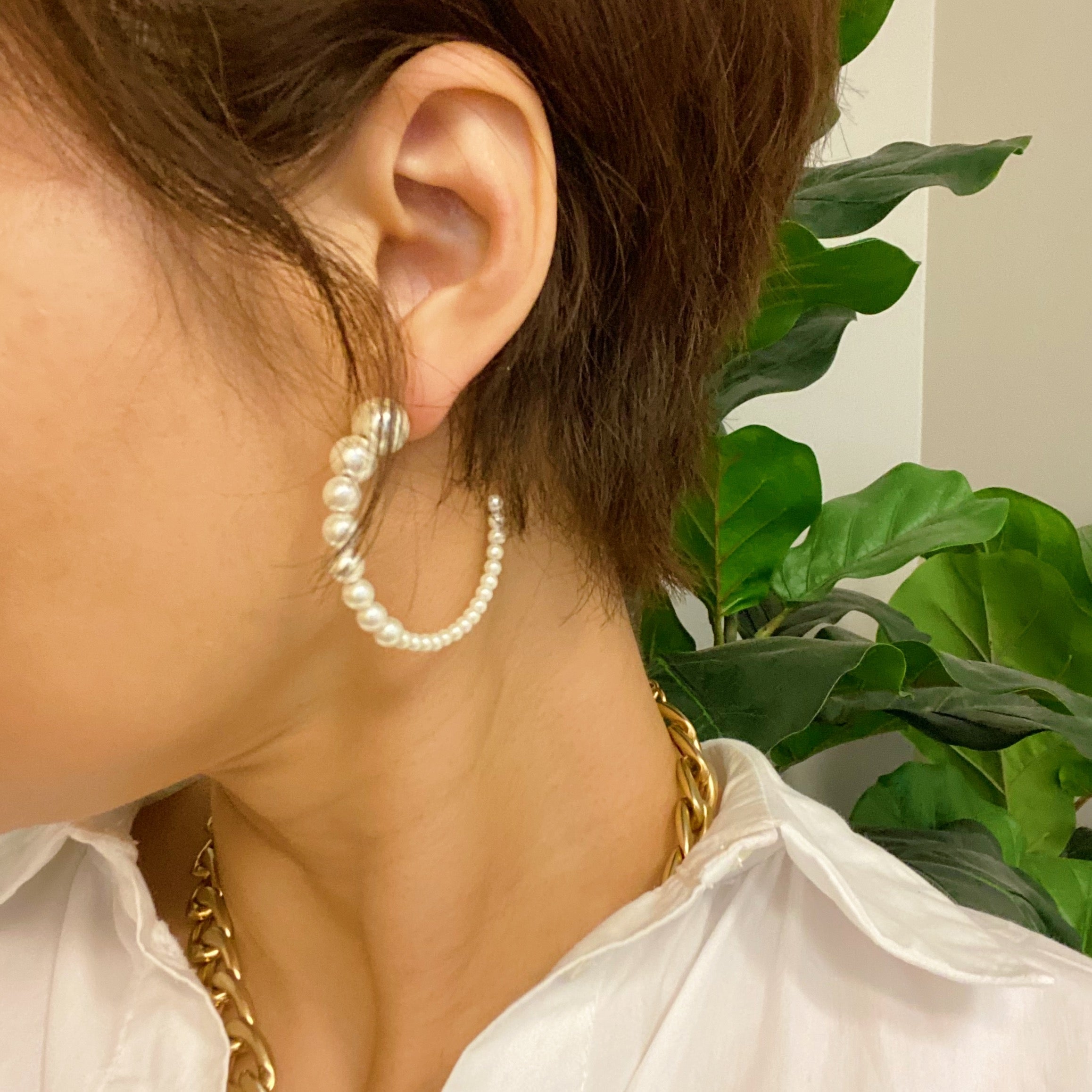 Stylish Gradation Bauble Hoop Earrings featuring a unique arrangement of large and small beads in a hoop design.