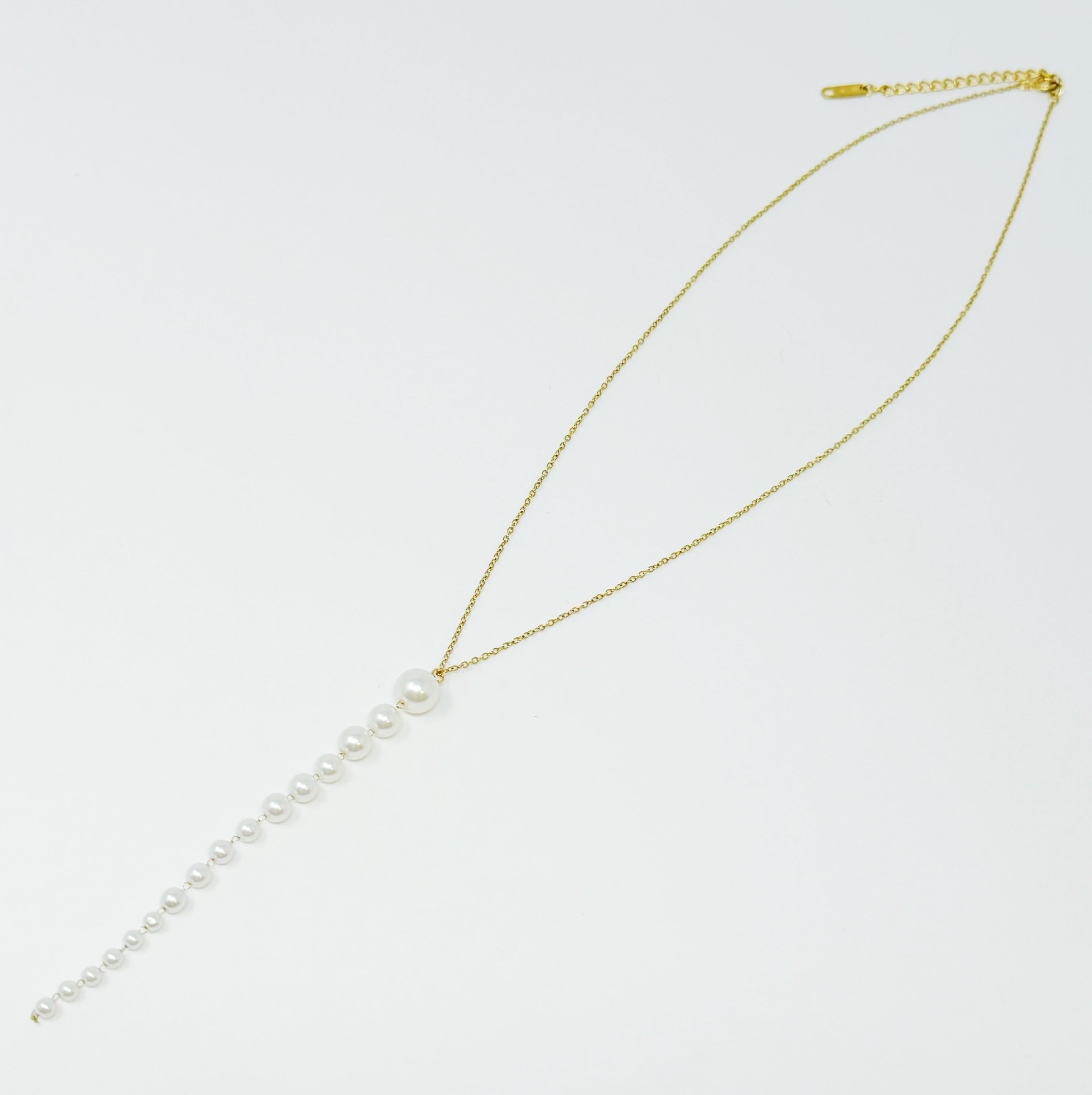 Gradiant Long Pearl Drop Necklace featuring elegant faux pearls and 18k gold plated stainless steel chain.