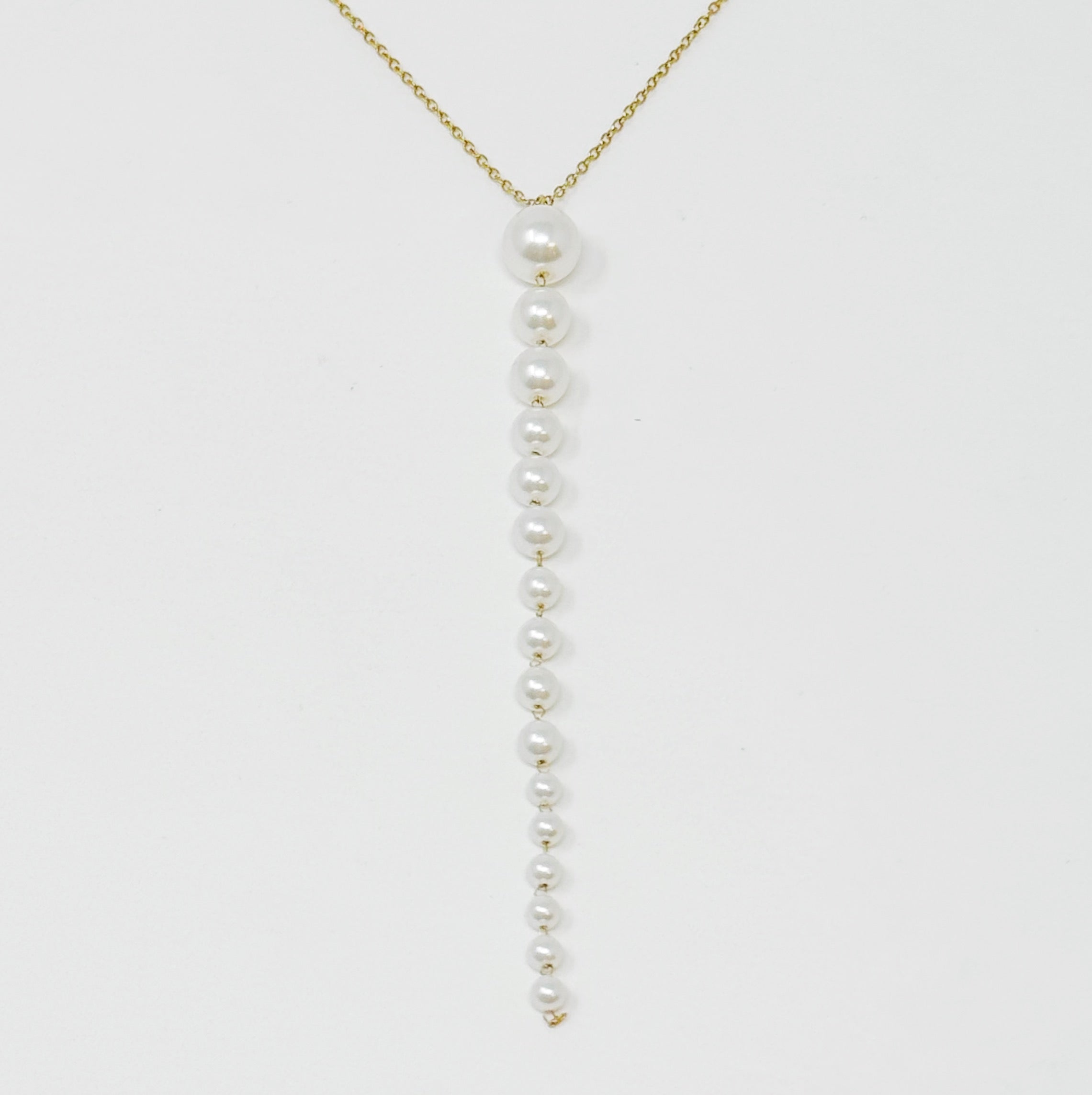 Gradiant Long Pearl Drop Necklace featuring elegant faux pearls and 18k gold plated stainless steel chain.