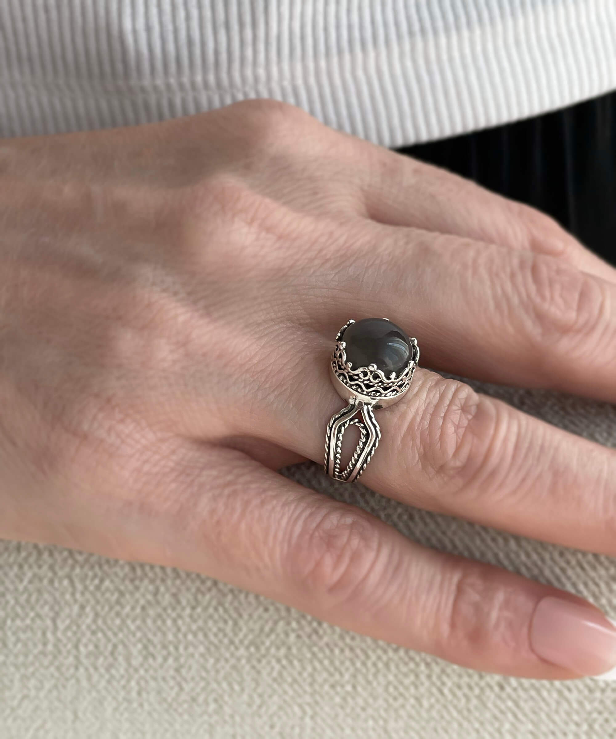 Elegant Gray Moonstone Gemstone Filigree Art Cocktail Ring in sterling silver, showcasing intricate design and a round cut gemstone.