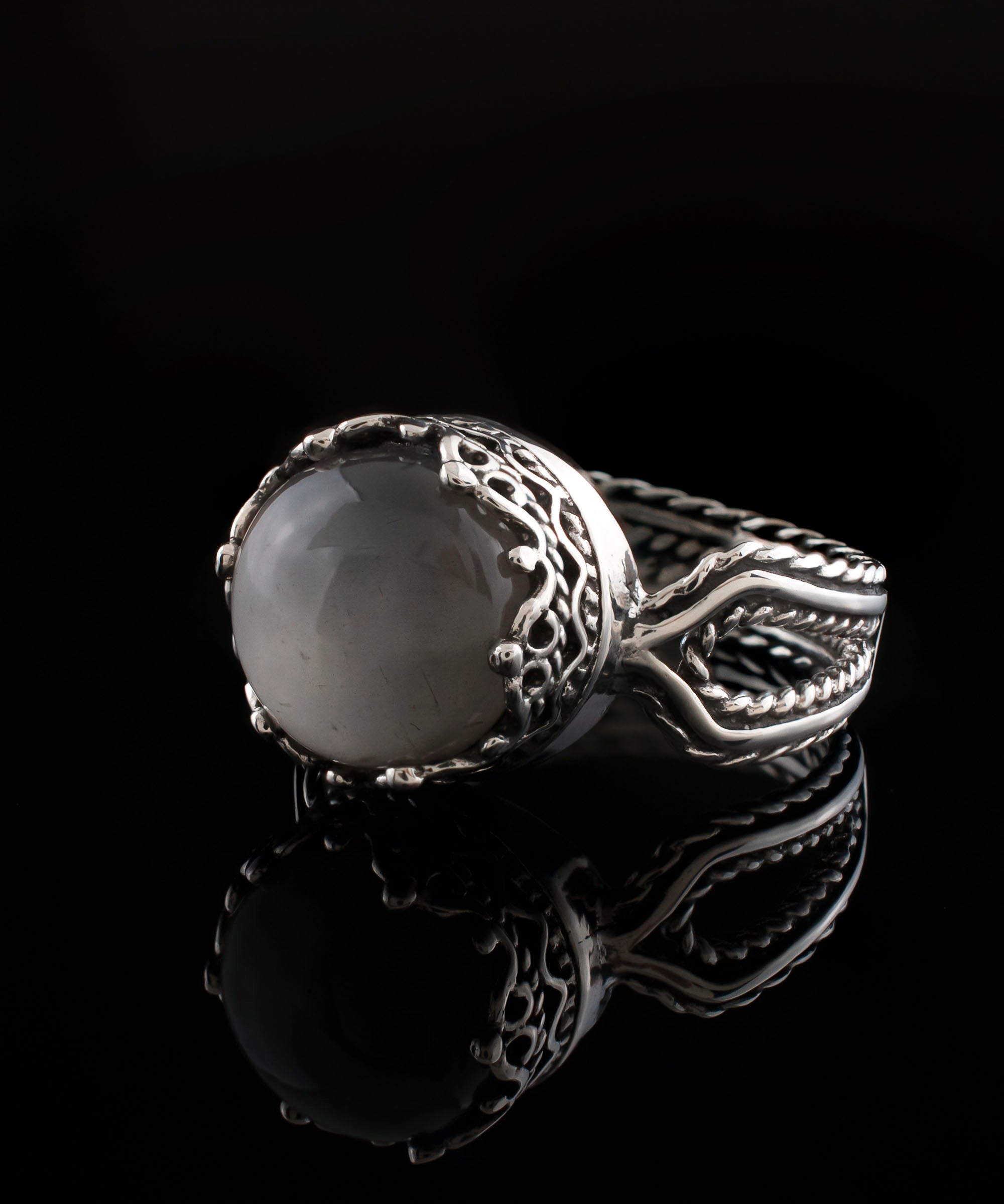 Elegant Gray Moonstone Gemstone Filigree Art Cocktail Ring in sterling silver, showcasing intricate design and a round cut gemstone.