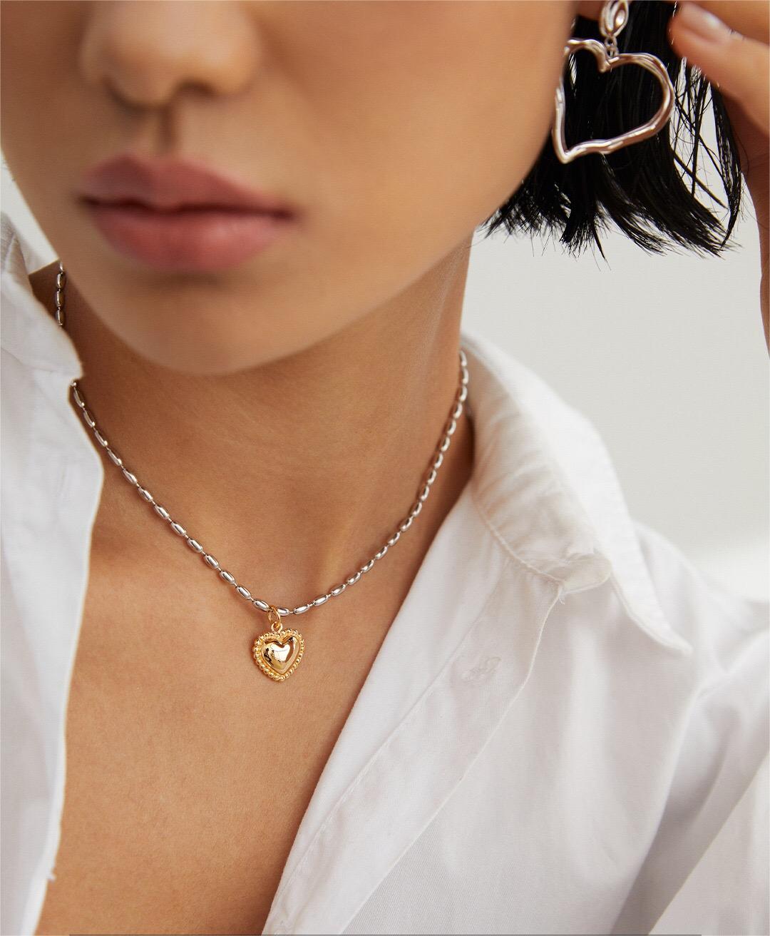 Gray Rice Pearl Necklace featuring a heart pendant, handmade with gold vermeil plating, showcasing elegance and craftsmanship.