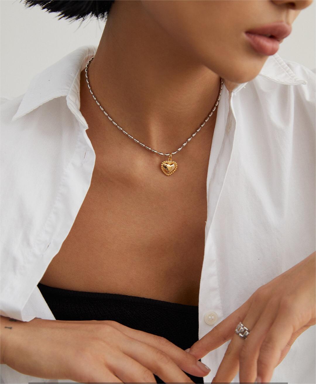 Gray Rice Pearl Necklace featuring a heart pendant, handmade with gold vermeil plating, showcasing elegance and craftsmanship.