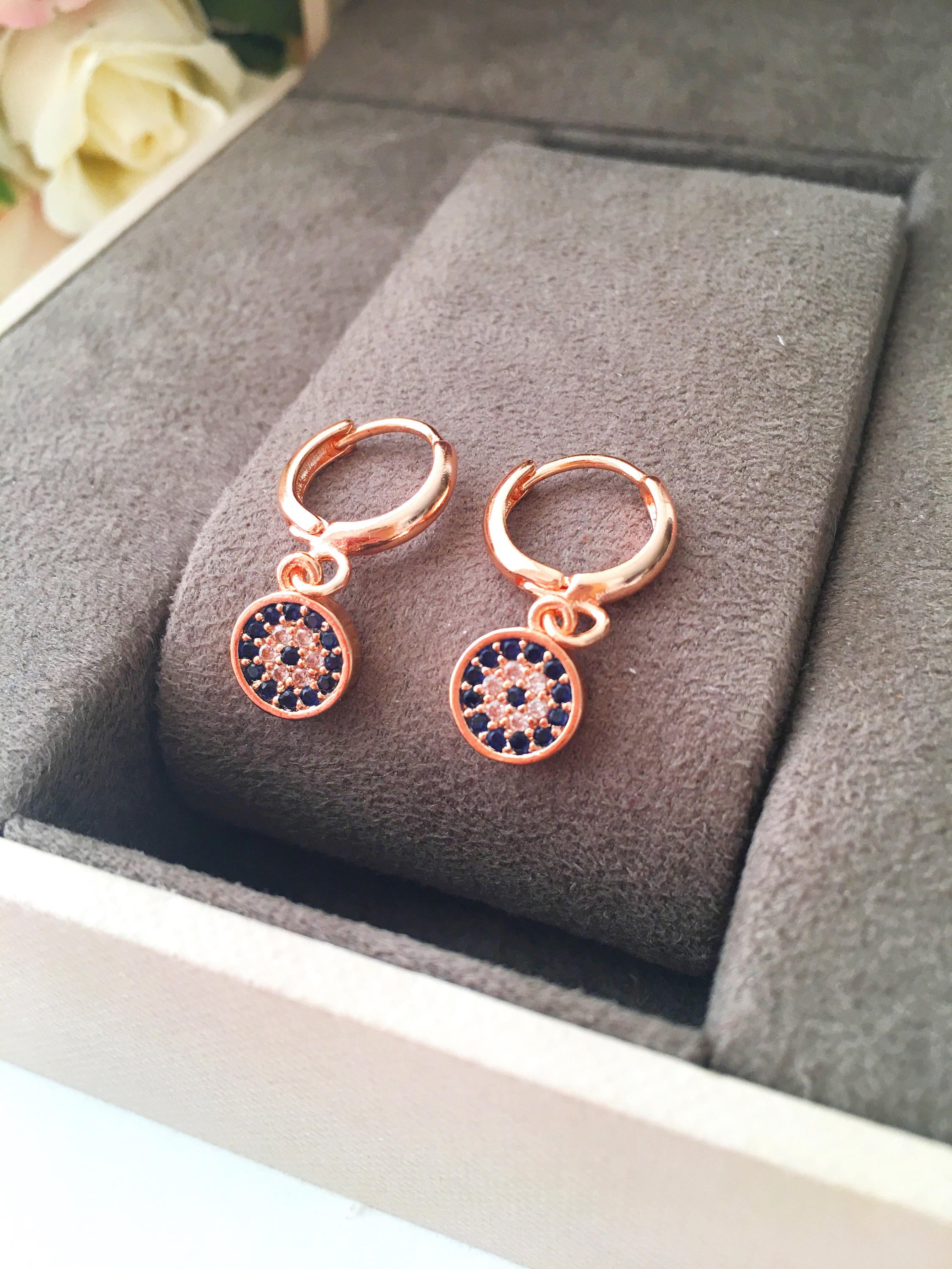 Handmade Greek Evil Eye Hoop Earrings in gold with zirconia stones, featuring a small hoop design and available in rose gold finish.