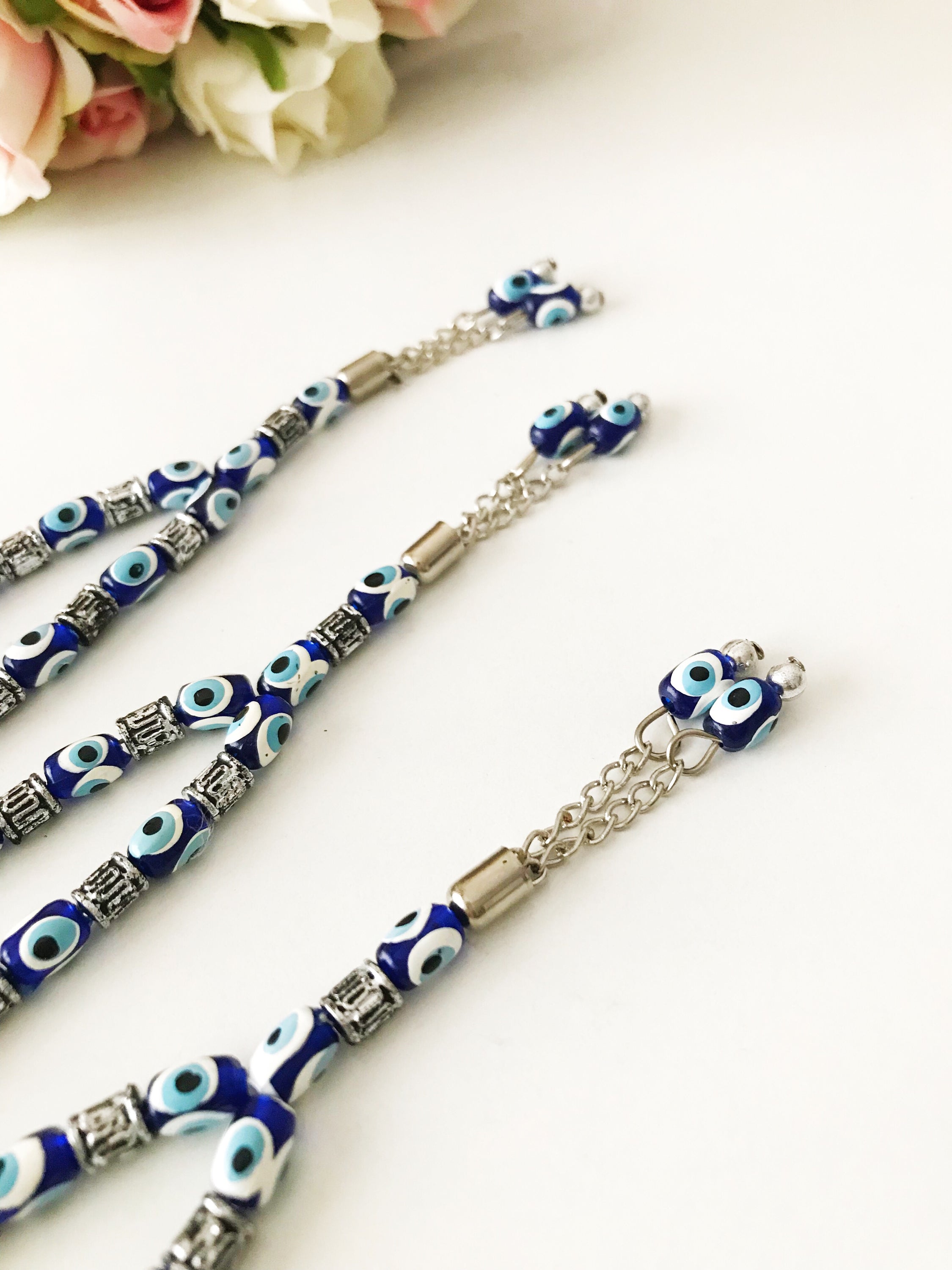 Handmade Greek komboloi featuring resin evil eye beads with silver accents, measuring 24cm in length.