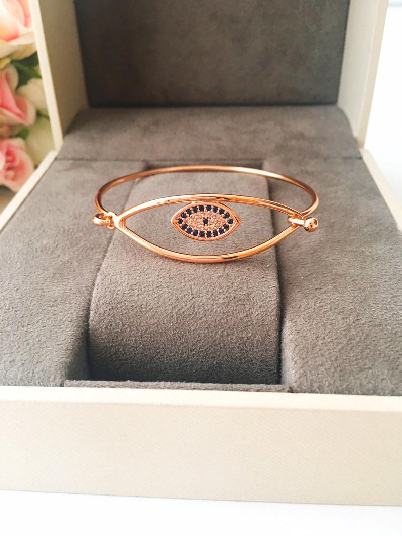 A beautiful Greek Lucky Evil Eye Bracelet in rose gold, showcasing intricate handmade details and an adjustable design.