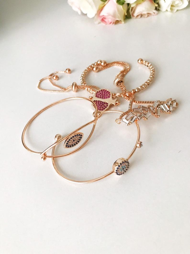 A beautiful Greek Lucky Evil Eye Bracelet in rose gold, showcasing intricate handmade details and an adjustable design.