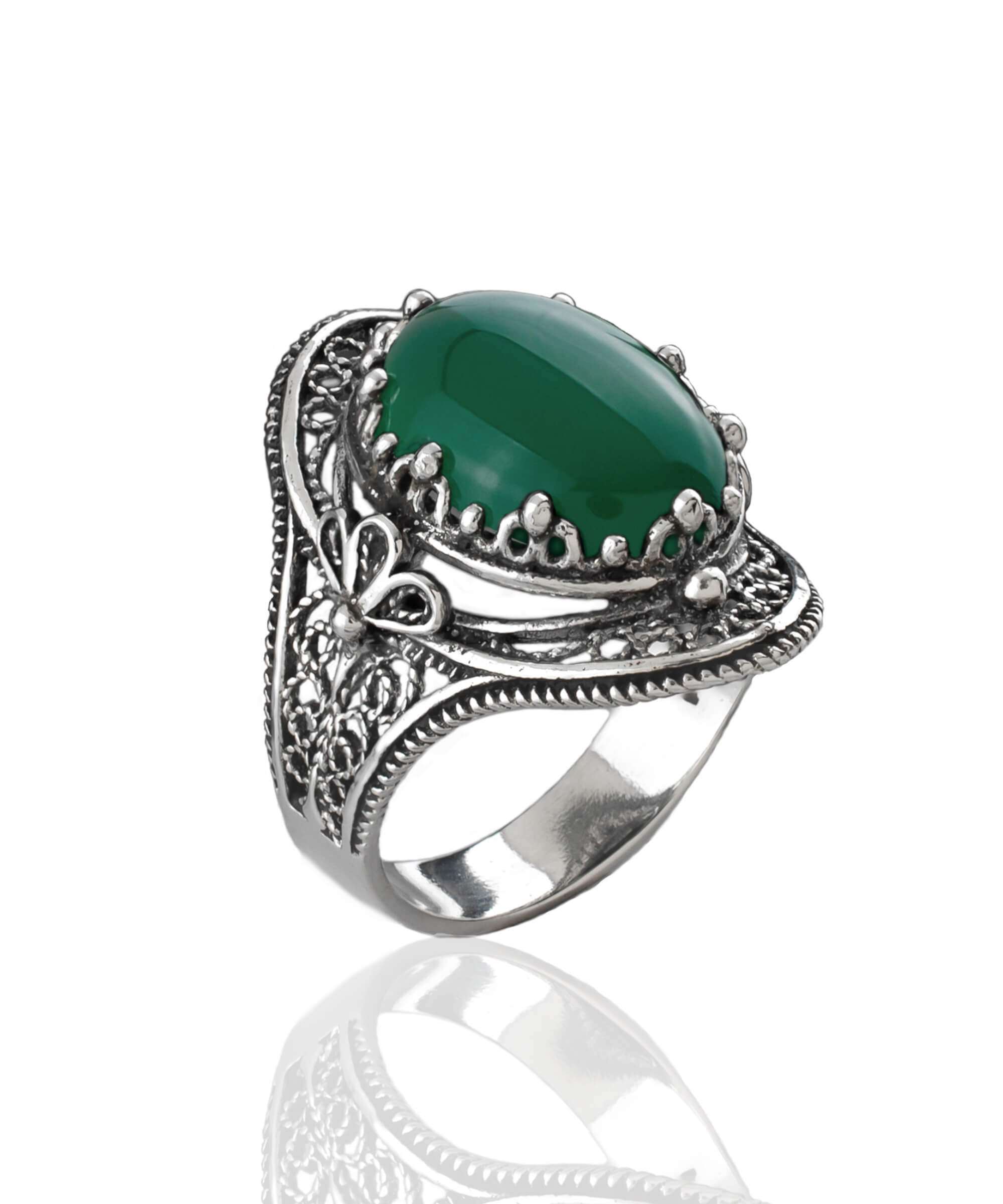 A beautiful handmade silver statement ring featuring a green agate gemstone in a filigree design, elegantly displayed in a gift box.