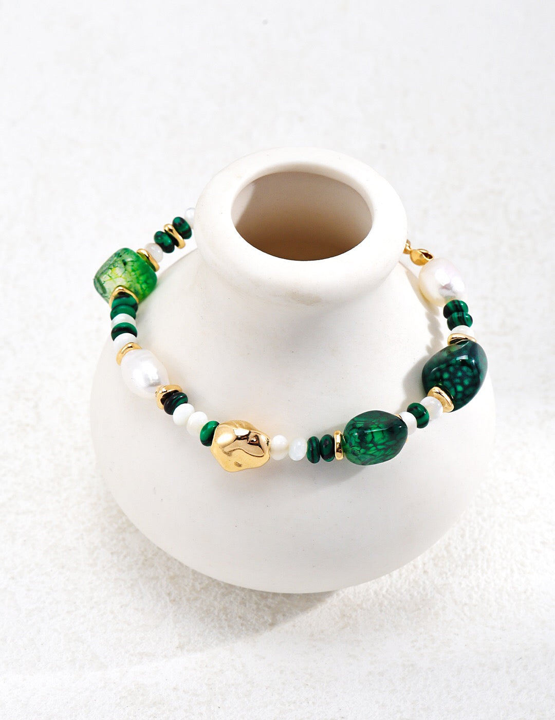 A handmade Green Agate with Pearl Beaded Bracelet featuring natural pearls and green agate stones, elegantly designed with gold vermeil accents.