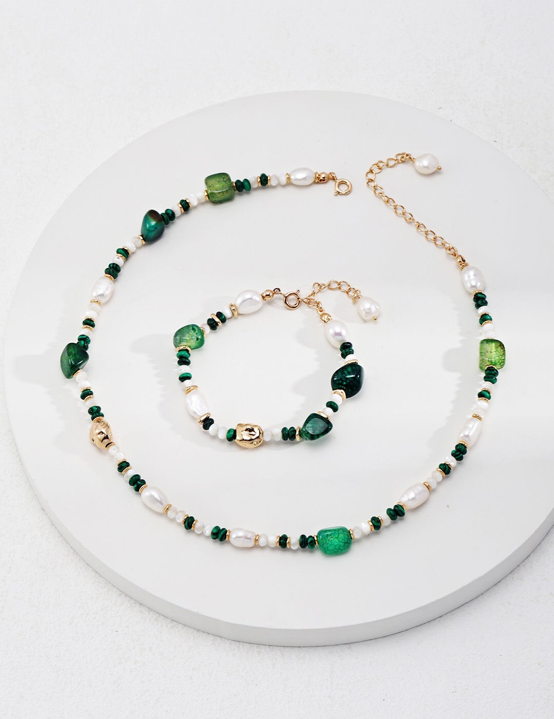 A handmade Green Agate with Pearl Beaded Bracelet featuring natural pearls and green agate stones, elegantly designed with gold vermeil accents.