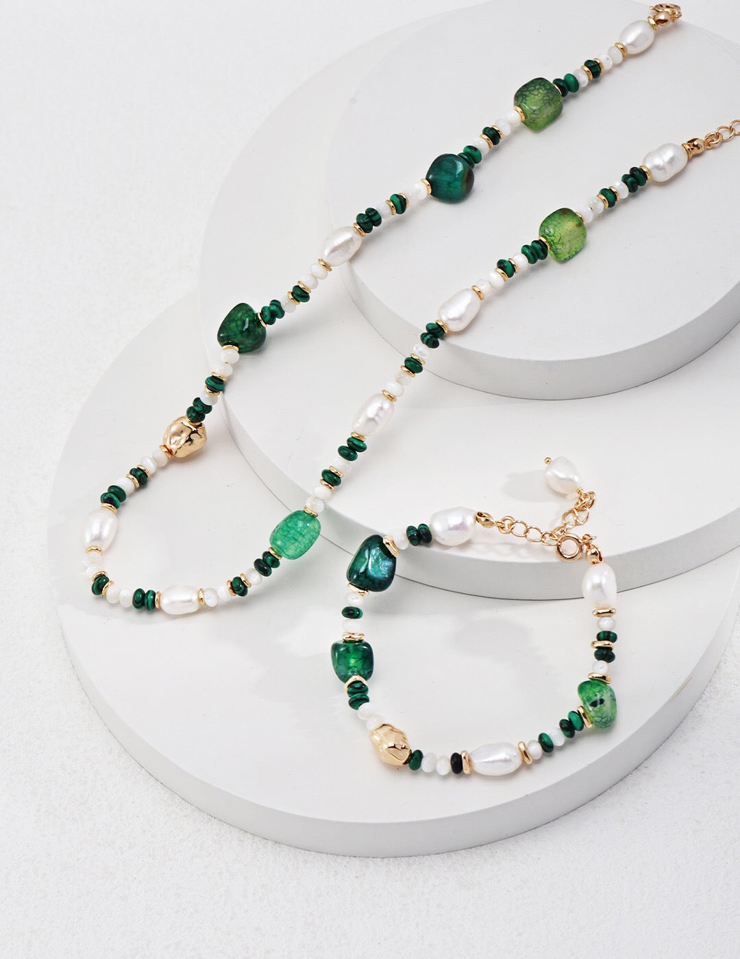 A handmade Green Agate with Pearl Beaded Bracelet featuring natural pearls and green agate stones, elegantly designed with gold vermeil accents.