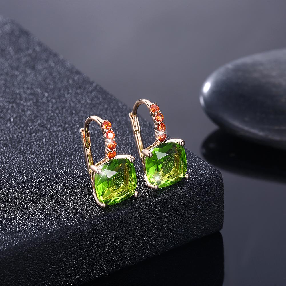 Elegant Green Asscher Cut Pav'e Leverback earrings in 14K gold, featuring certified crystals and a luxurious design.