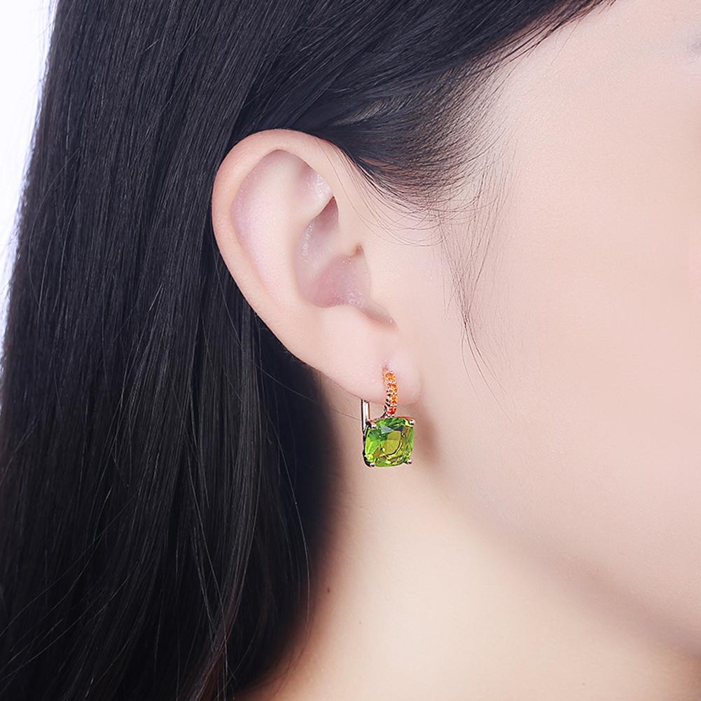 Elegant Green Asscher Cut Pav'e Leverback earrings in 14K gold, featuring certified crystals and a luxurious design.