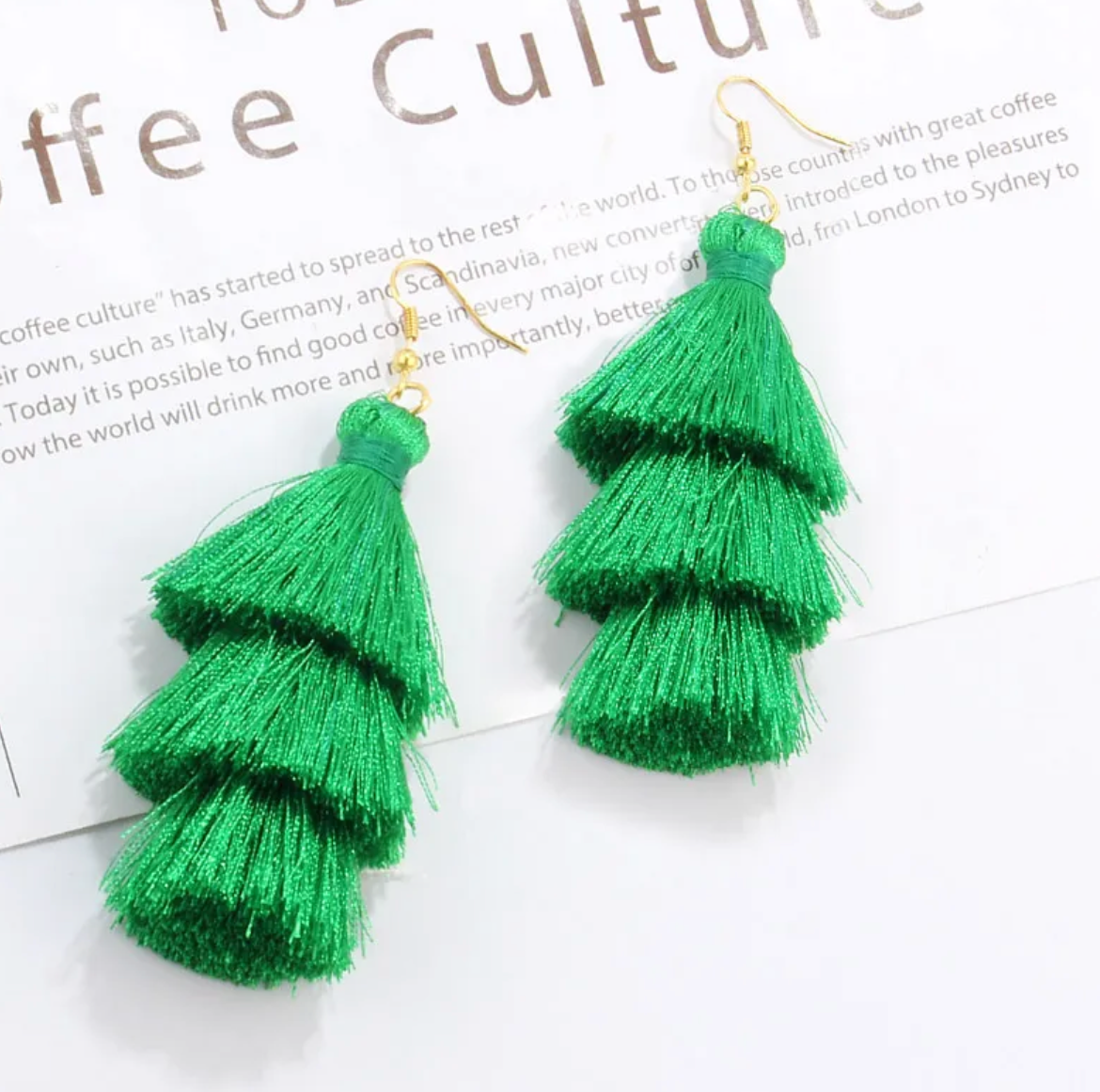 Stylish Green Craze Tassel Earrings featuring lightweight silky material and lead-free hooks, perfect for dressing up any outfit.