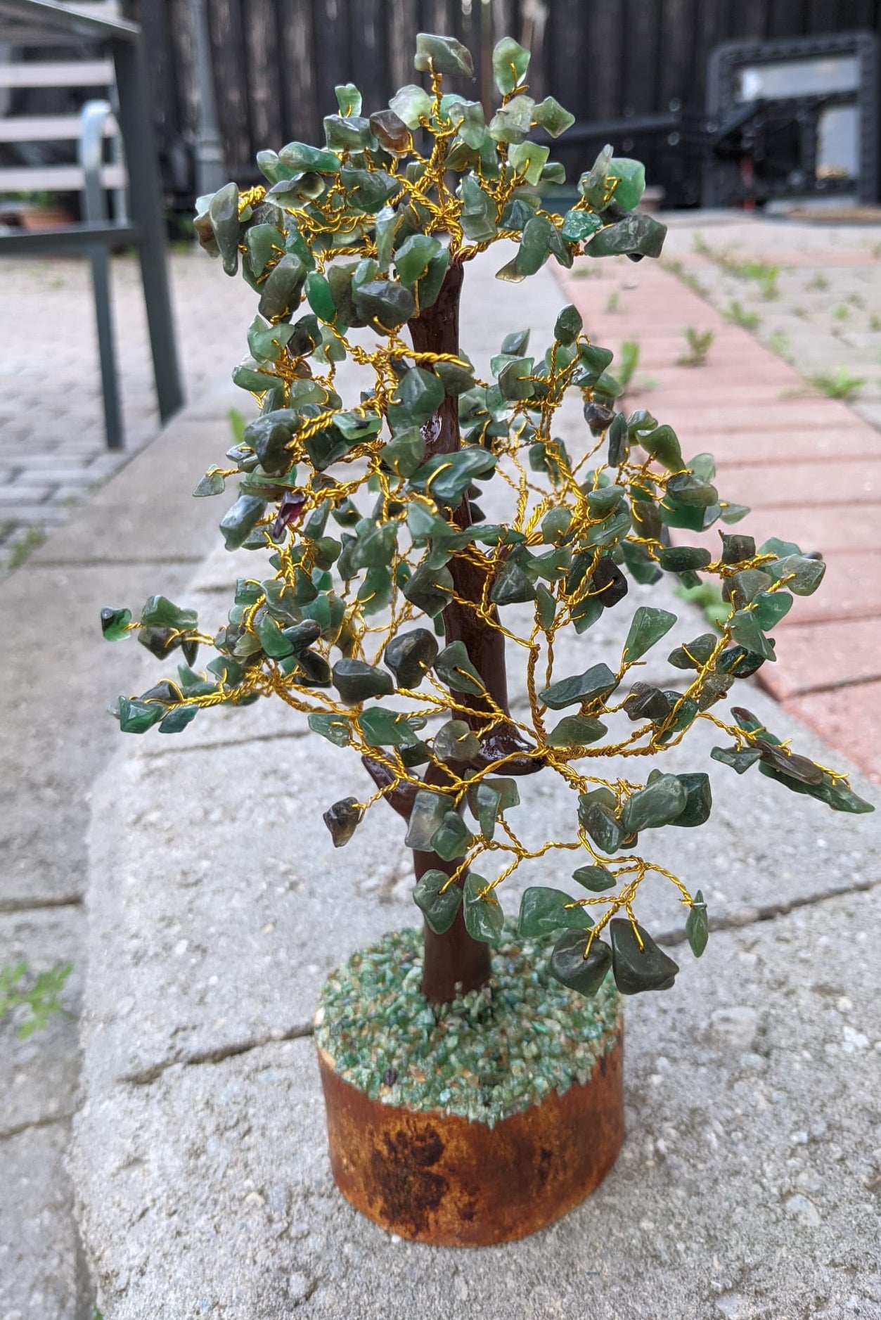 A beautifully hand-carved Green Jade Gemstone Tree featuring 300 unique jade chips, symbolizing good fortune and luck.