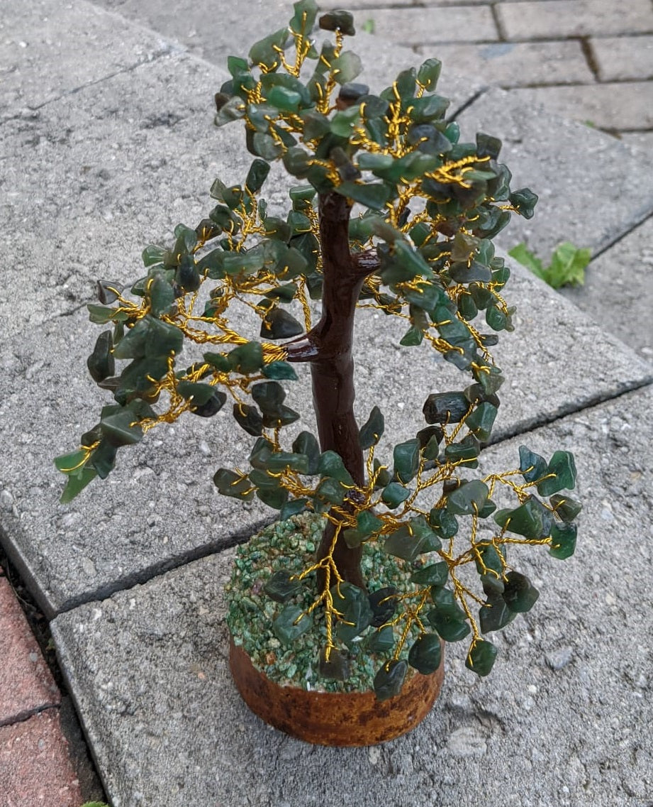 A beautifully hand-carved Green Jade Gemstone Tree featuring 300 unique jade chips, symbolizing good fortune and luck.