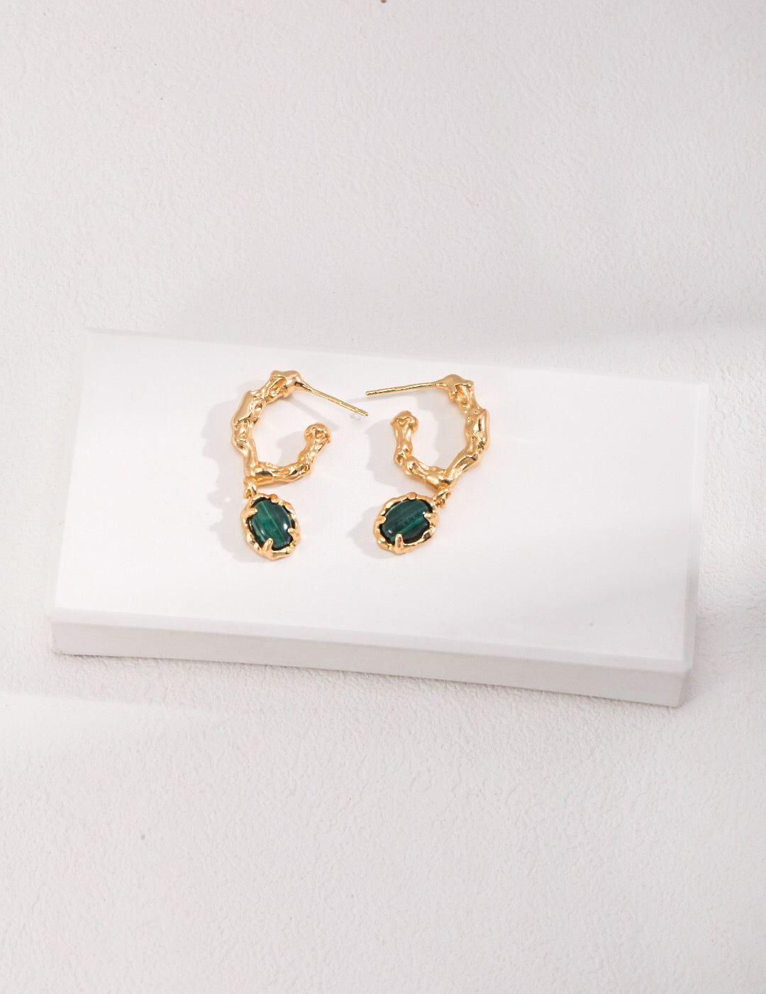 Elegant Green Malachite Hoop Earrings featuring gold vermeil accents, showcasing vibrant green hues and unique patterns.