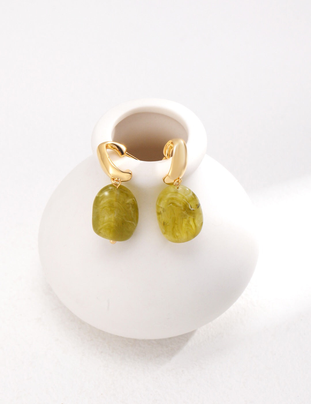 Elegant green resin stone drop earrings with gold vermeil finish, showcasing a unique handmade design.