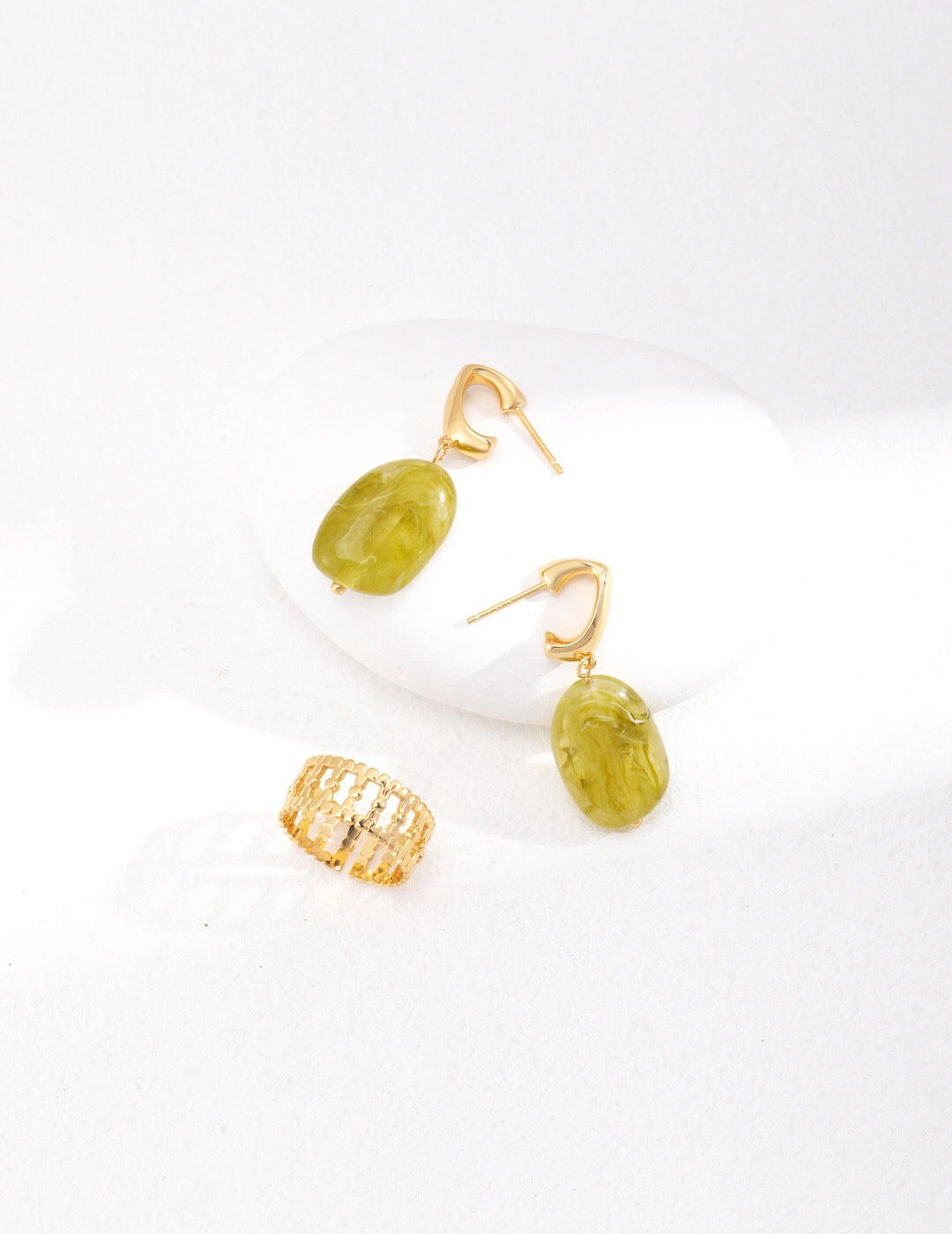 Elegant green resin stone drop earrings with gold vermeil finish, showcasing a unique handmade design.