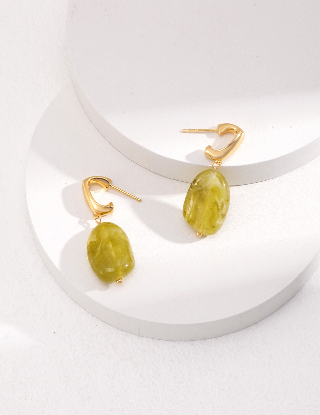 Elegant green resin stone drop earrings with gold vermeil finish, showcasing a unique handmade design.