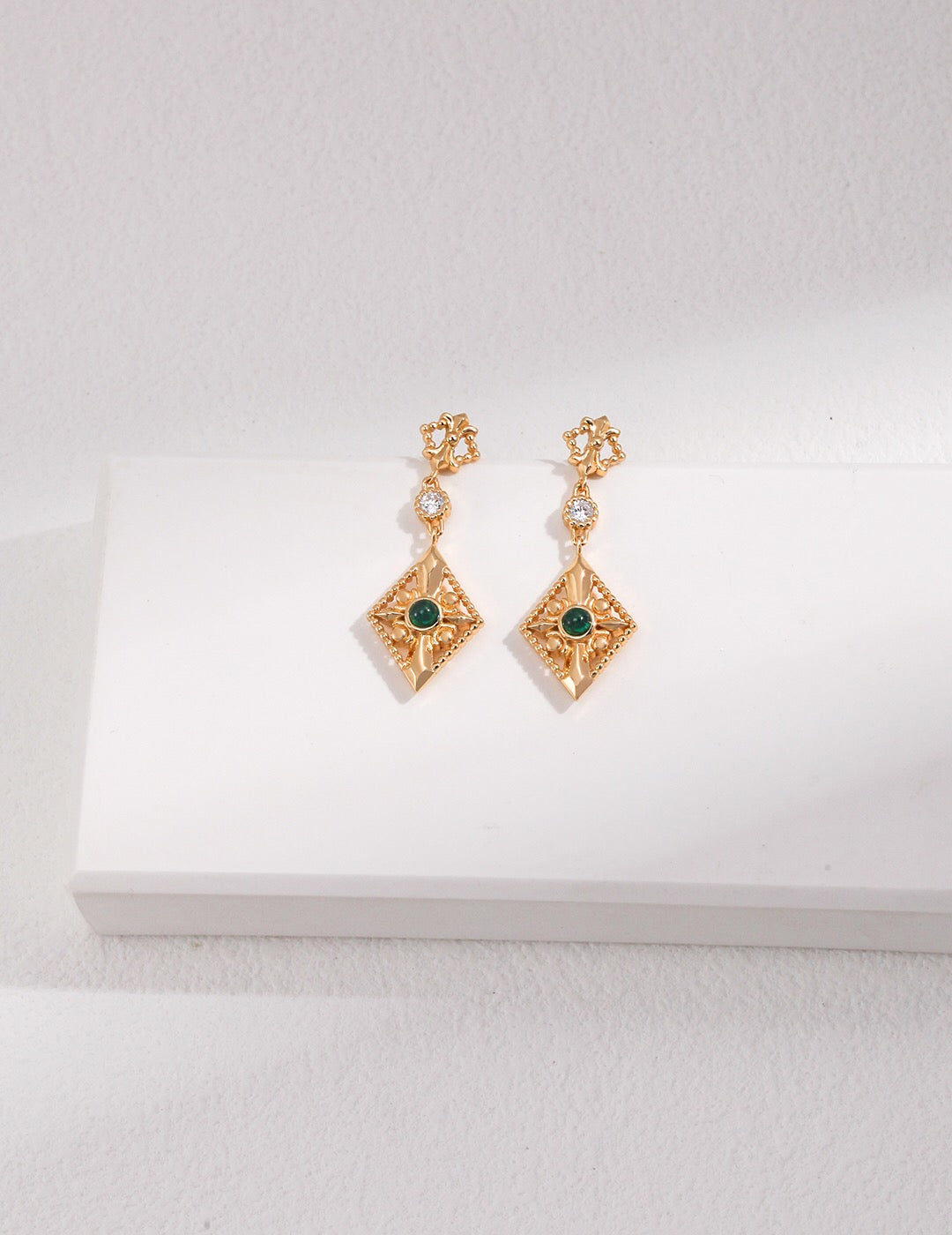 Elegant Green Zircon Rhombus Earrings made of sterling silver and gold vermeil, showcasing their unique design and vibrant color.