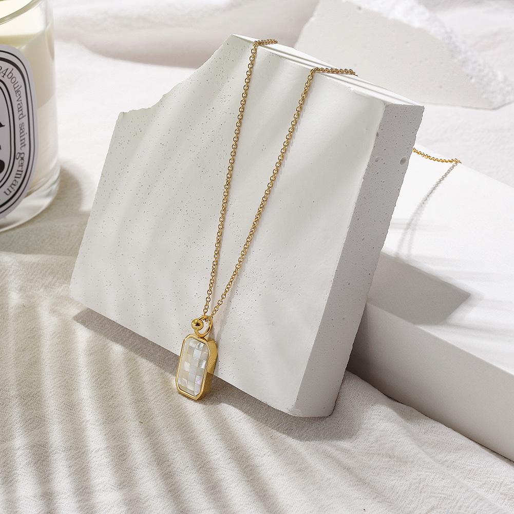 GRID Natural Shell Pendant Necklace featuring an elegant opal design and a delicate 14k gold chain, perfect for daily wear.