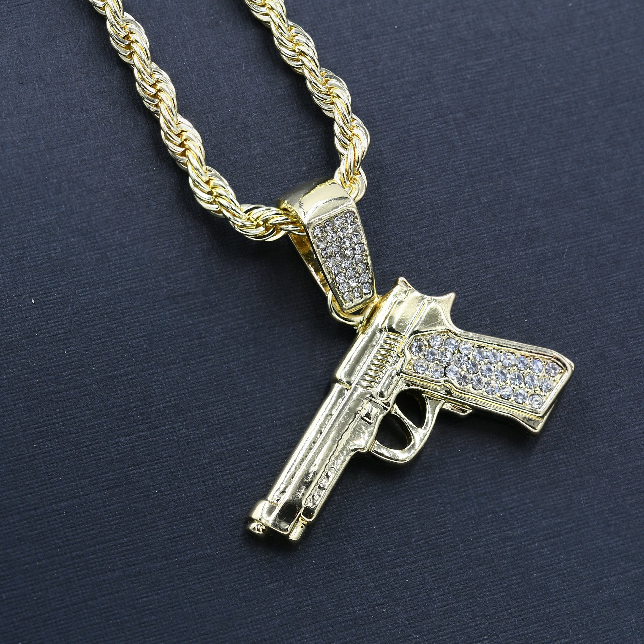 GUN CHAIN AND CHARM - D911112 featuring a crystal-studded pendant on a 24'' rope chain, showcasing intricate hip-hop jewelry design.