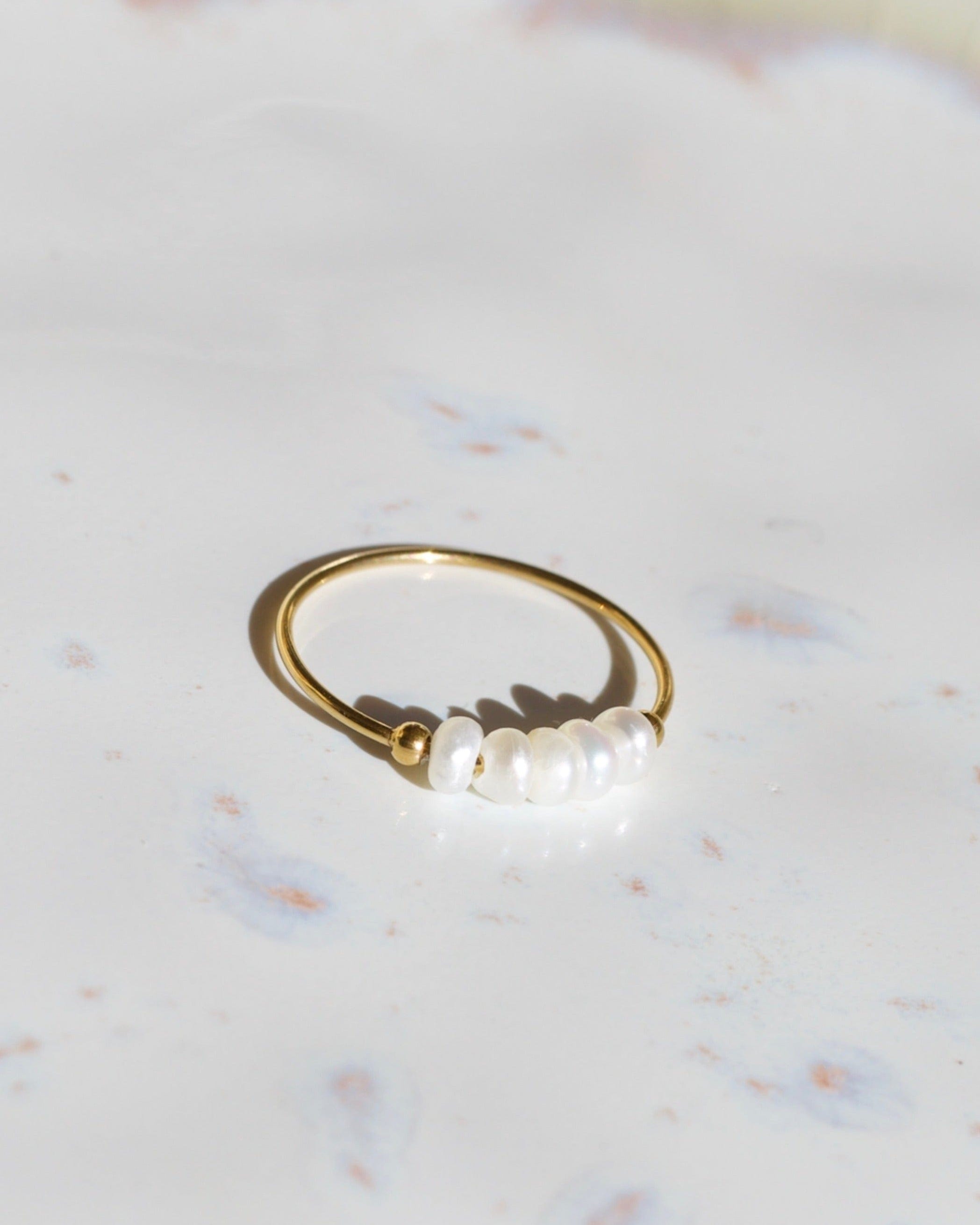 Gurk Pearl Ring Gold featuring a minimalist geometric design with genuine freshwater seed pearls and 18k gold plating.