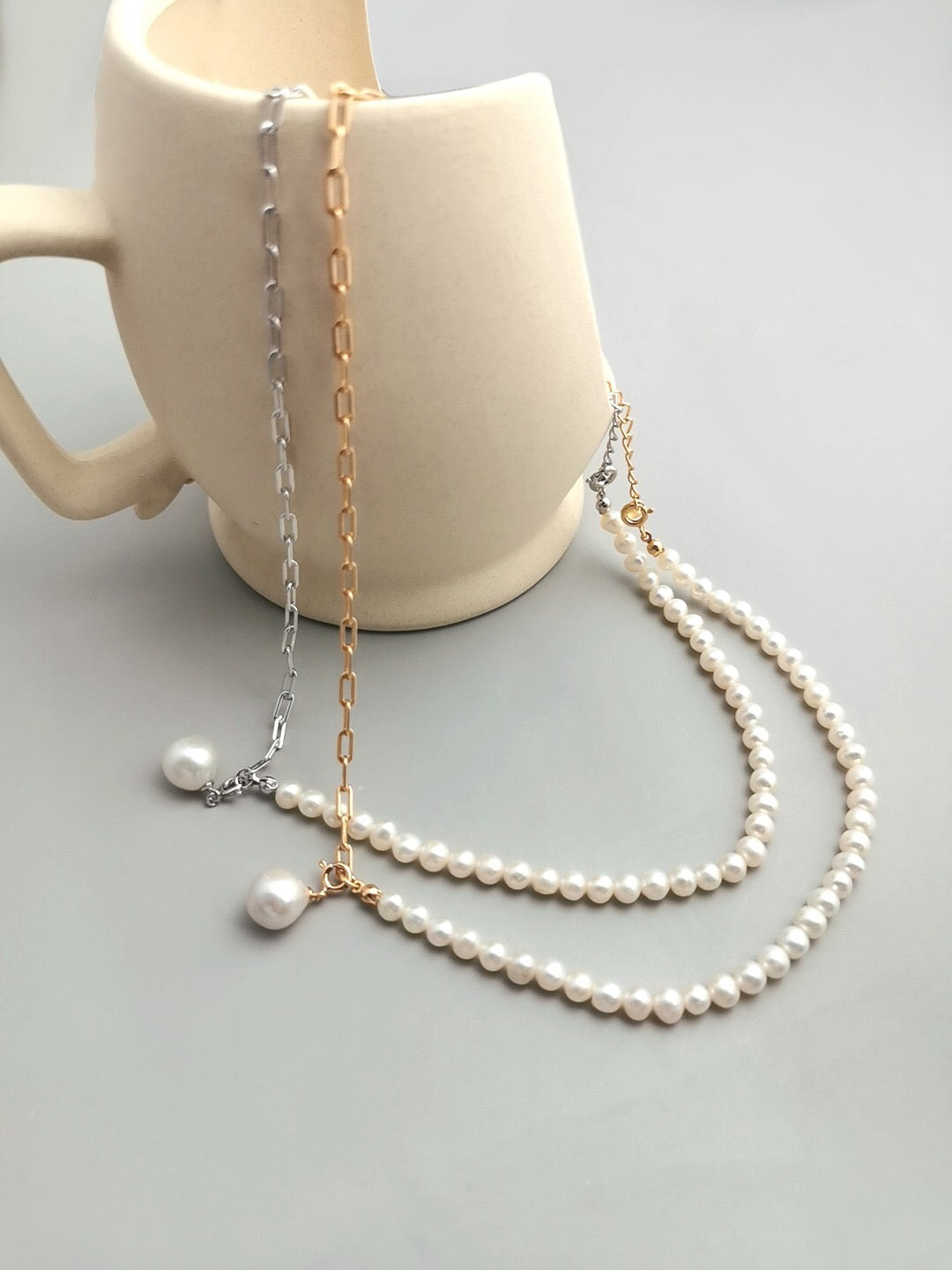 Half Chain Half Pearl Pendant Necklace featuring natural pearls and sterling silver, elegantly designed for a sophisticated look.