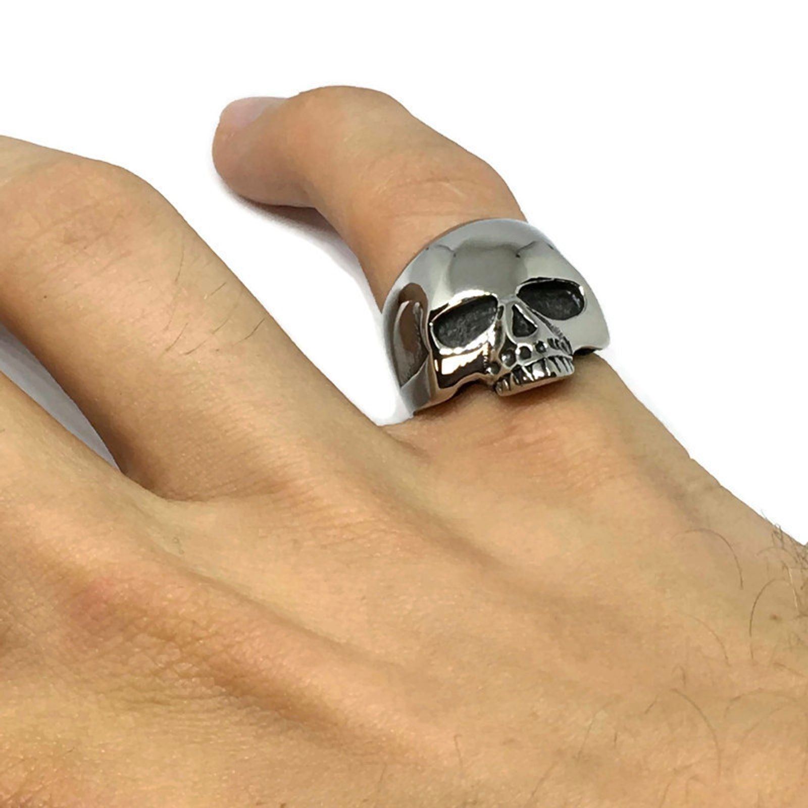 Half-Skull Stainless Steel Ring showcasing intricate skull design and shiny finish, perfect for unisex wear.