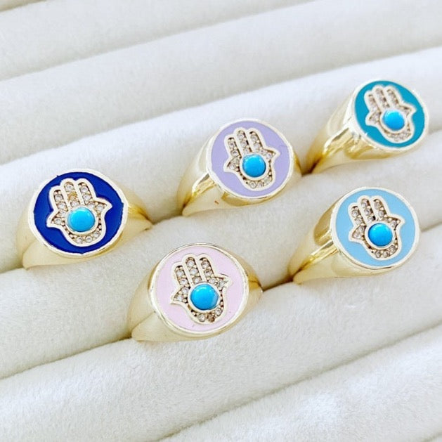 Adjustable Hamsa Evil Eye Ring with gold band and colorful hamsa charm, perfect for stacking.