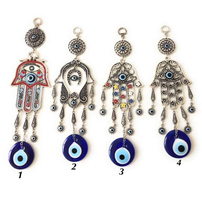 A beautifully crafted Hamsa evil eye wall decor featuring a mosaic metal hand and a large evil eye bead, symbolizing protection and good luck.