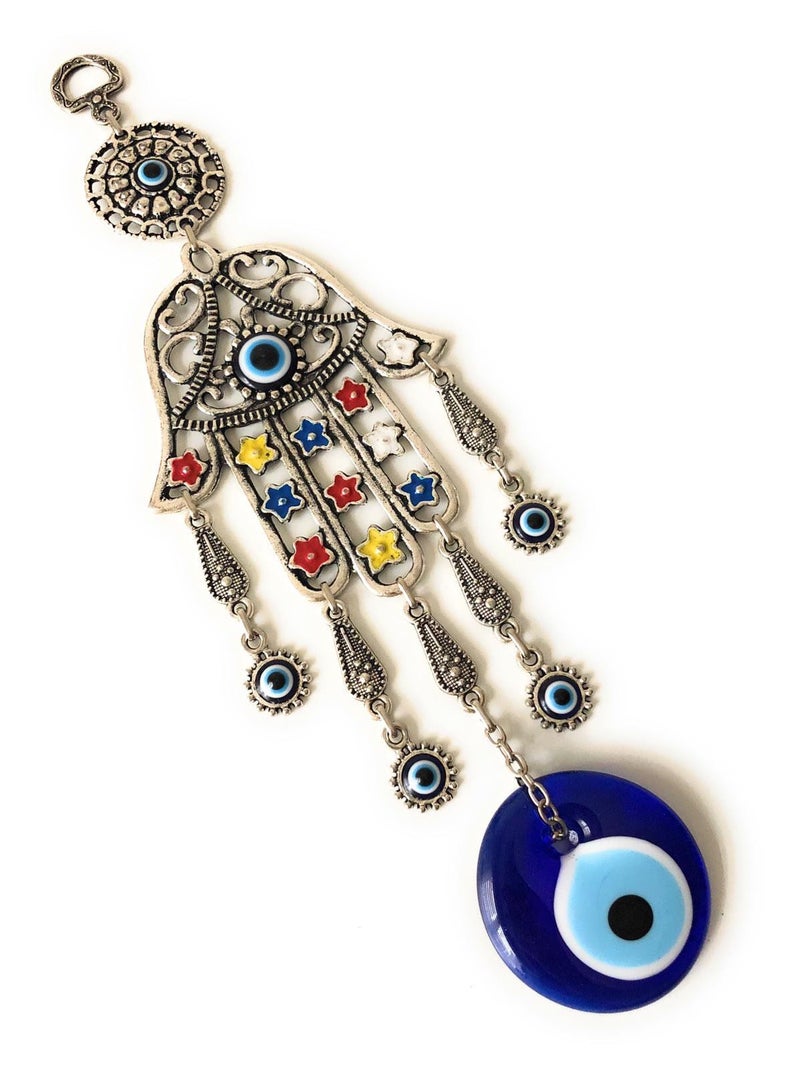 A beautifully crafted Hamsa evil eye wall decor featuring a mosaic metal hand and a large evil eye bead, symbolizing protection and good luck.