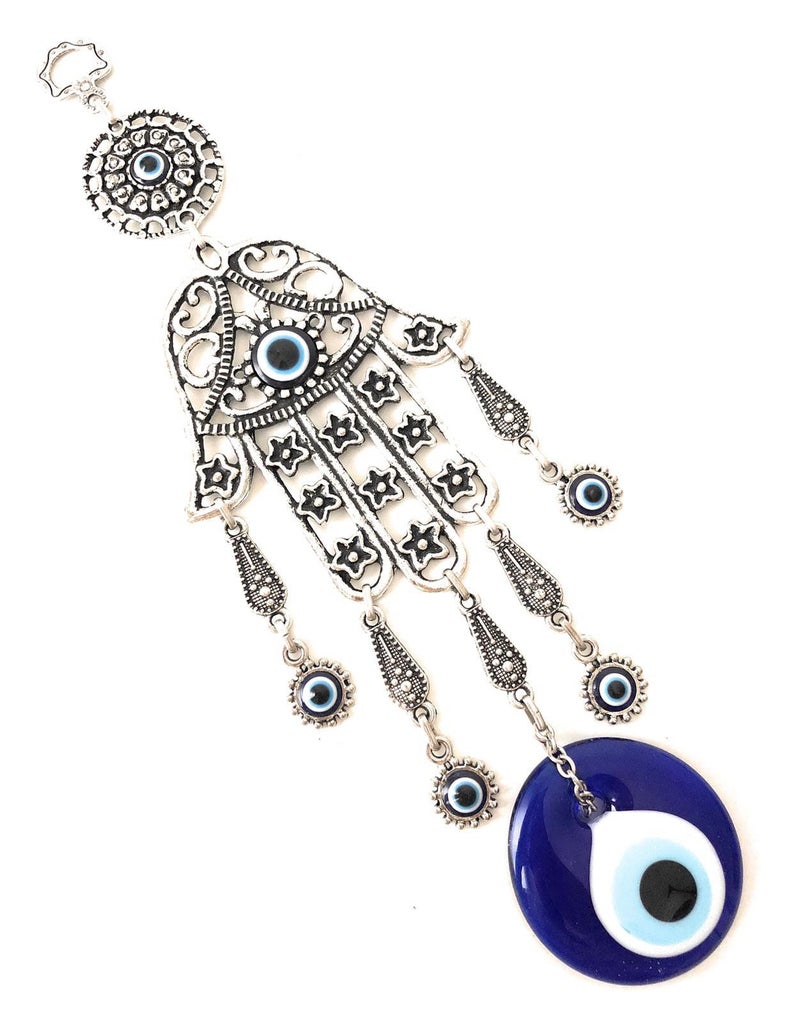 A beautifully crafted Hamsa evil eye wall decor featuring a mosaic metal hand and a large evil eye bead, symbolizing protection and good luck.