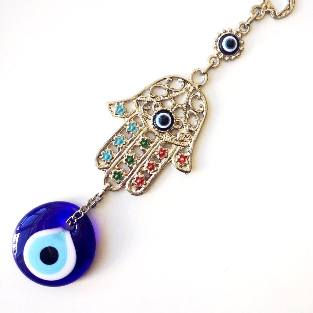 Handmade Hamsa Evil Eye Wall Decor featuring a metal Hamsa hand and a large evil eye bead, symbolizing protection and good luck.