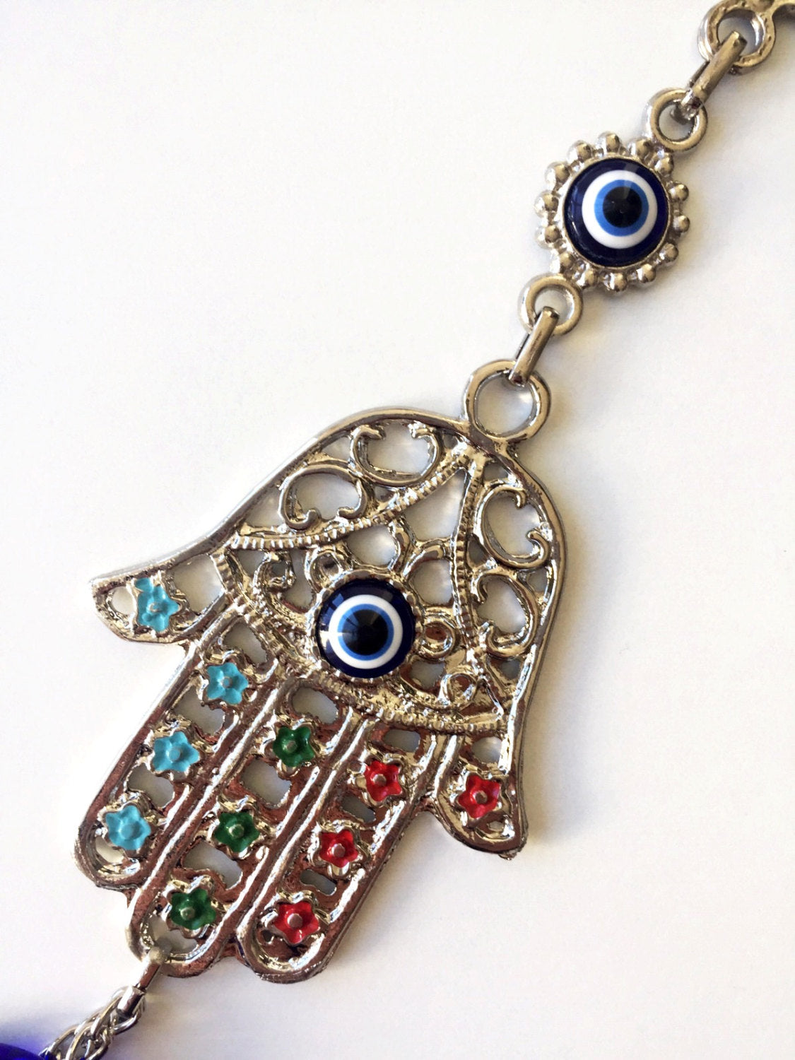 Handmade Hamsa Evil Eye Wall Decor featuring a metal Hamsa hand and a large evil eye bead, symbolizing protection and good luck.