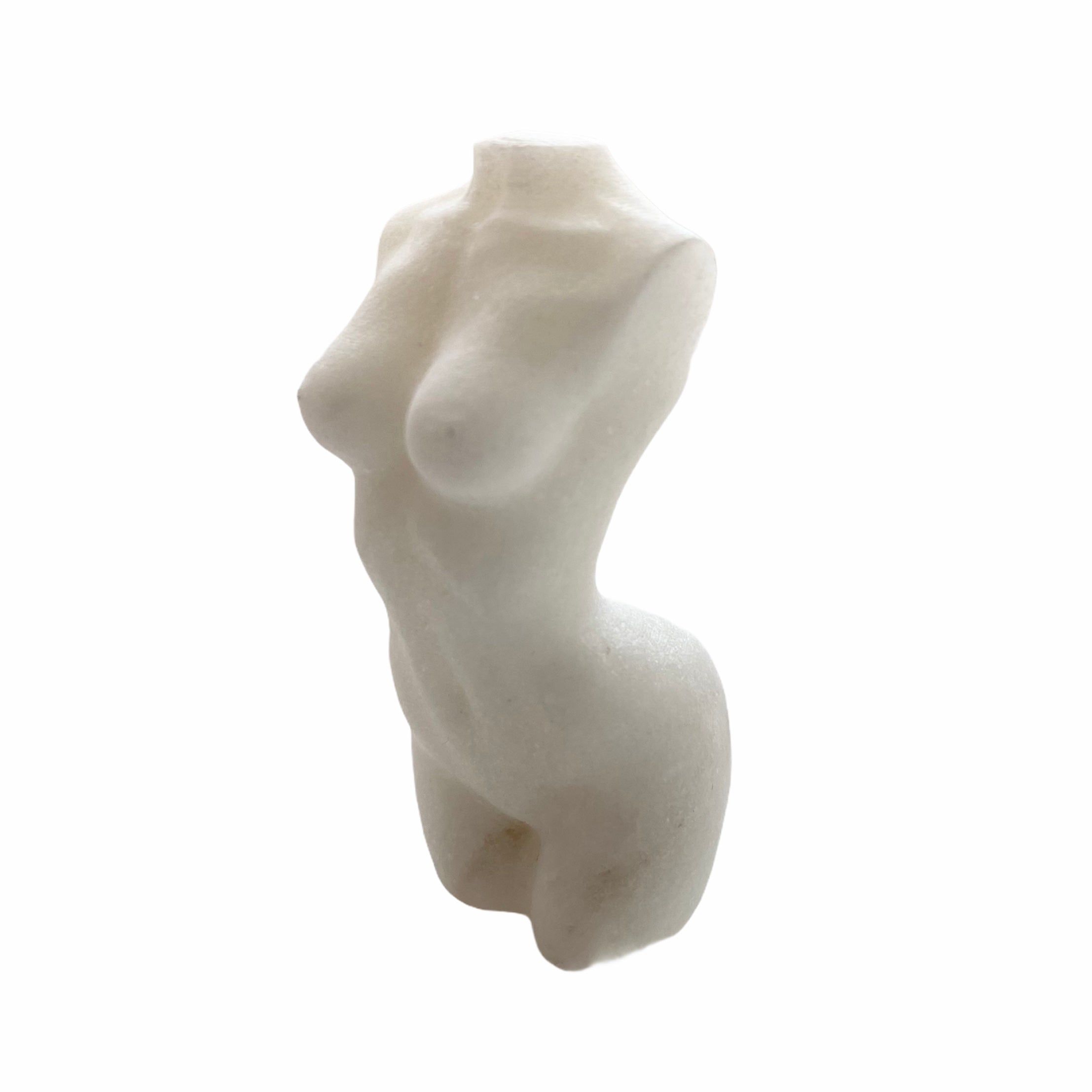 A beautifully hand carved female form statue made from natural stone, showcasing intricate details and celebrating femininity.