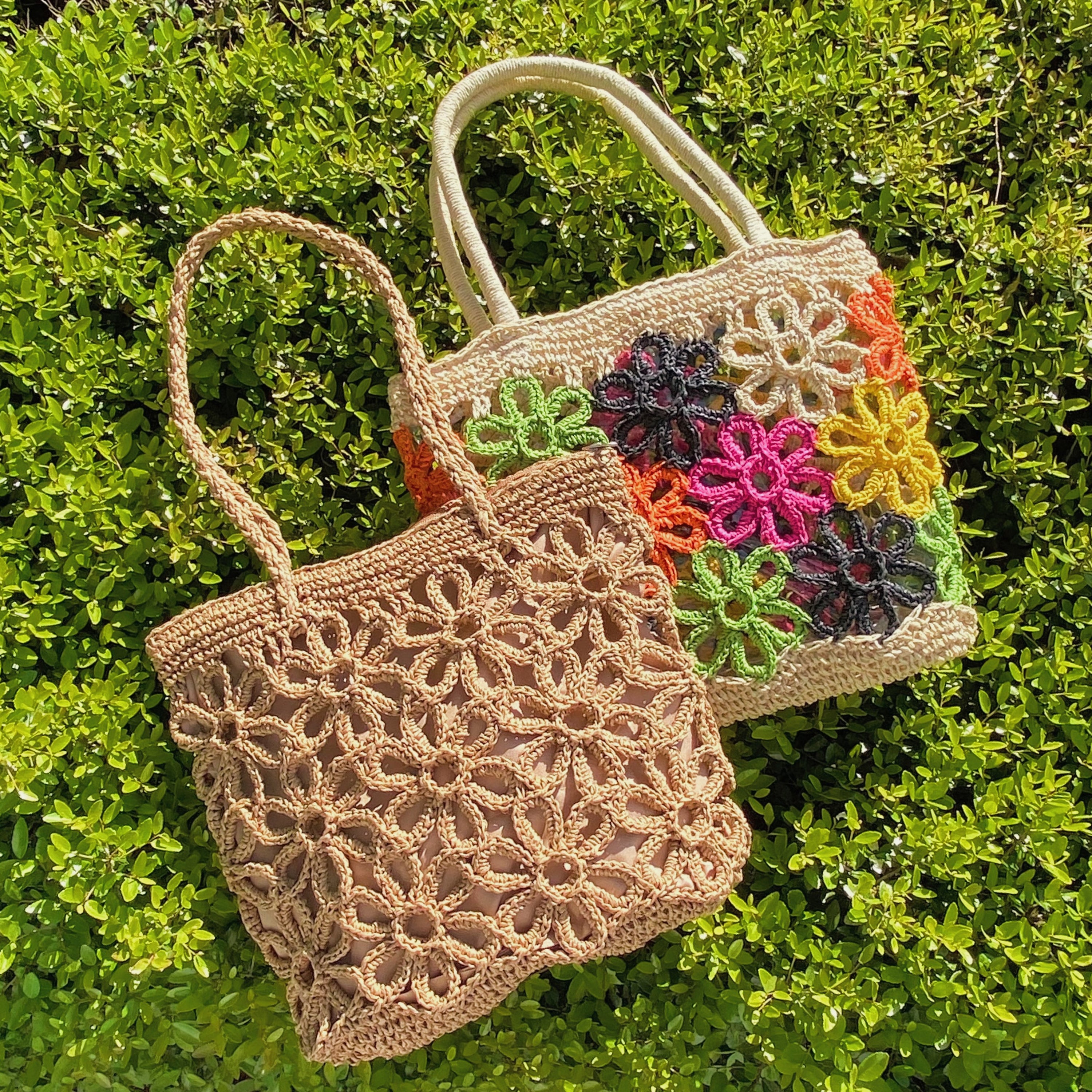 Hand Made Flower Power Tote featuring colorful flower detailing and a clear plastic lining, crafted from durable paper straw.