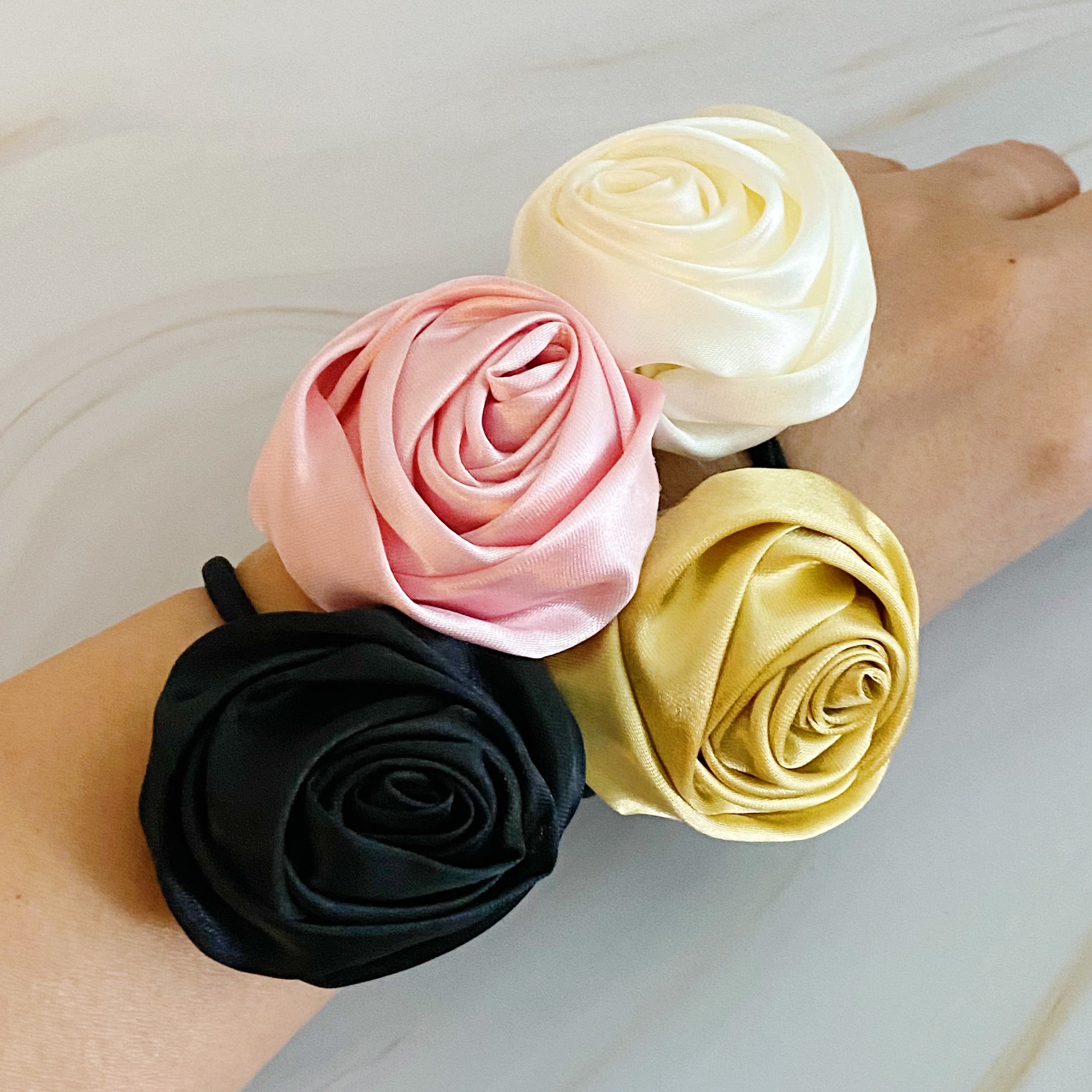 Hand Picked Satin Rose Hair Tie Set of 4 in neutral colors, featuring elegant rose-shaped designs.