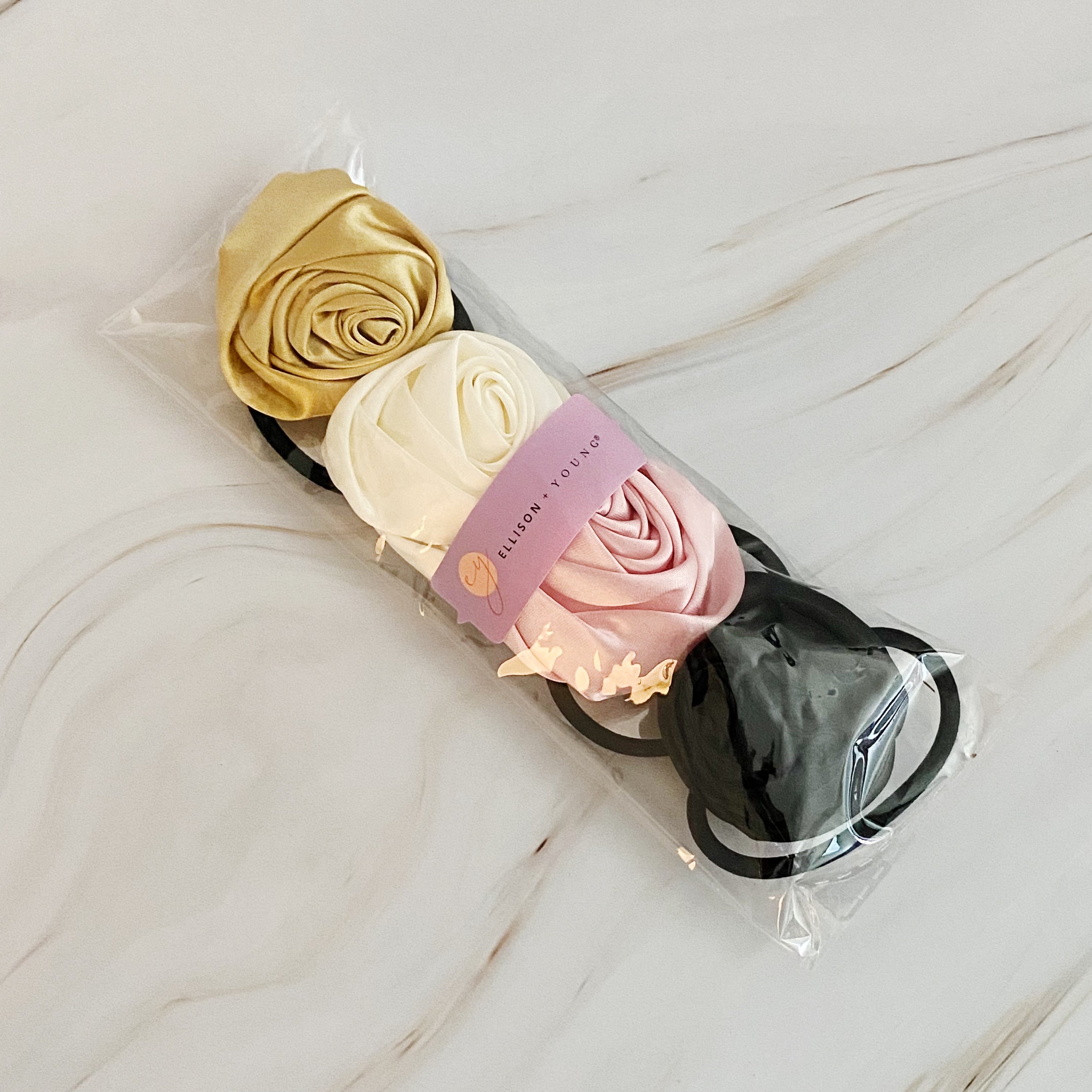 Hand Picked Satin Rose Hair Tie Set of 4 in neutral colors, featuring elegant rose-shaped designs.