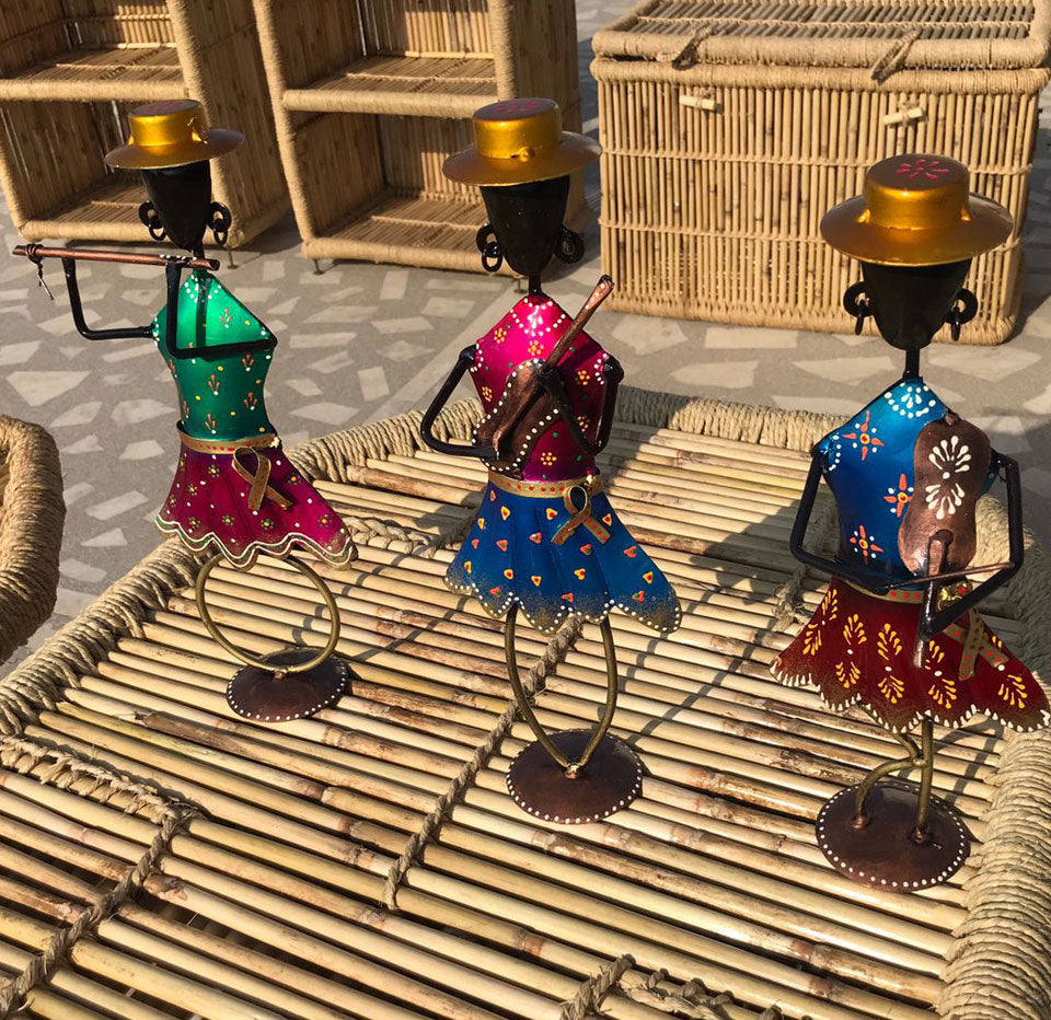 Set of 3 handcrafted musical dancing dolls made from wrought iron, showcasing vibrant colors and intricate details.